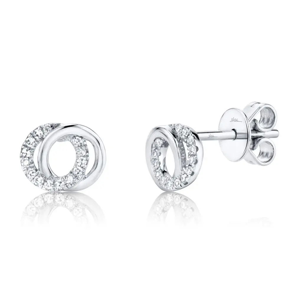 Charming yet practical, this piece offers all-day style and comfort, perfect for any occasion. Shy Creation diamonds are natural and hand-selected. All stones are unique and hand set. As a result, you can expect slight variations in the shade, hue, tint of the color stones and stone count.-14k White gold-Round diamonds, 0.09cts-Dimensions, 0.25"L / 0.30"WItem# 805-2000008 Diamond Love Knot Circle Earrings