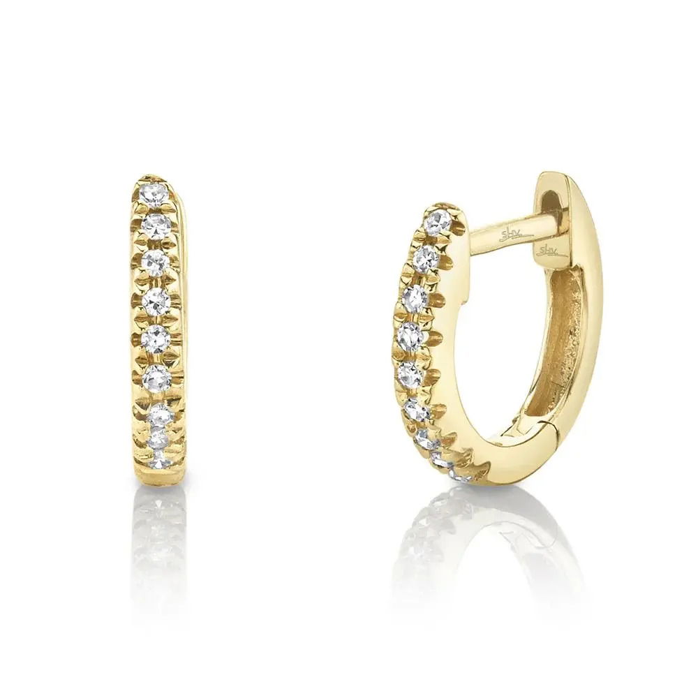 Sleek yet captivating, this minimalist piece is designed to draw attention. All Shy Creation diamonds are natural and hand-selected. All stones are unique and hand set. As a result, you can expect slight variations in the shade, hue, tint of the color stones and stone count.-14k Yellow gold-Round diamonds, 0.04cts-Dimensions, 0.35"L / 0.06"WItem# 805-2000047 Diamond Mini Huggie Earrings
