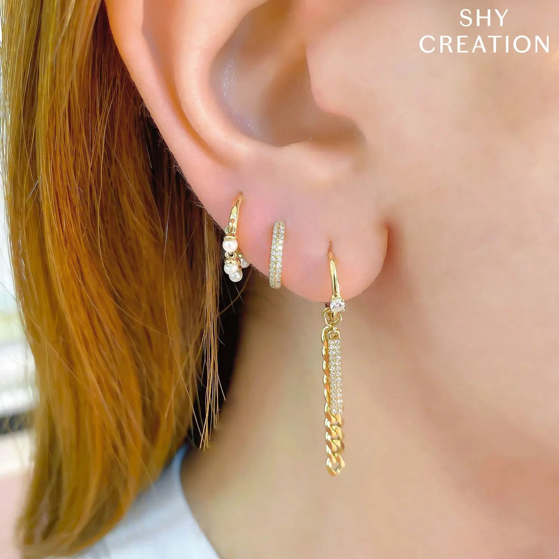This striking statement piece commands attention with its unique design, ensuring you’ll stand out. All Shy Creation diamonds are natural and hand-selected. All stones are unique and hand set. As a result, you can expect slight variations in the shade, hue, tint of the color stones and stone count.-14k Yellow gold-Pearls, 2.3-2.5mm-Dimensions, 0.60"L / 0.10"WItem# 805-2000028 Cultured Pearl Huggie Earrings