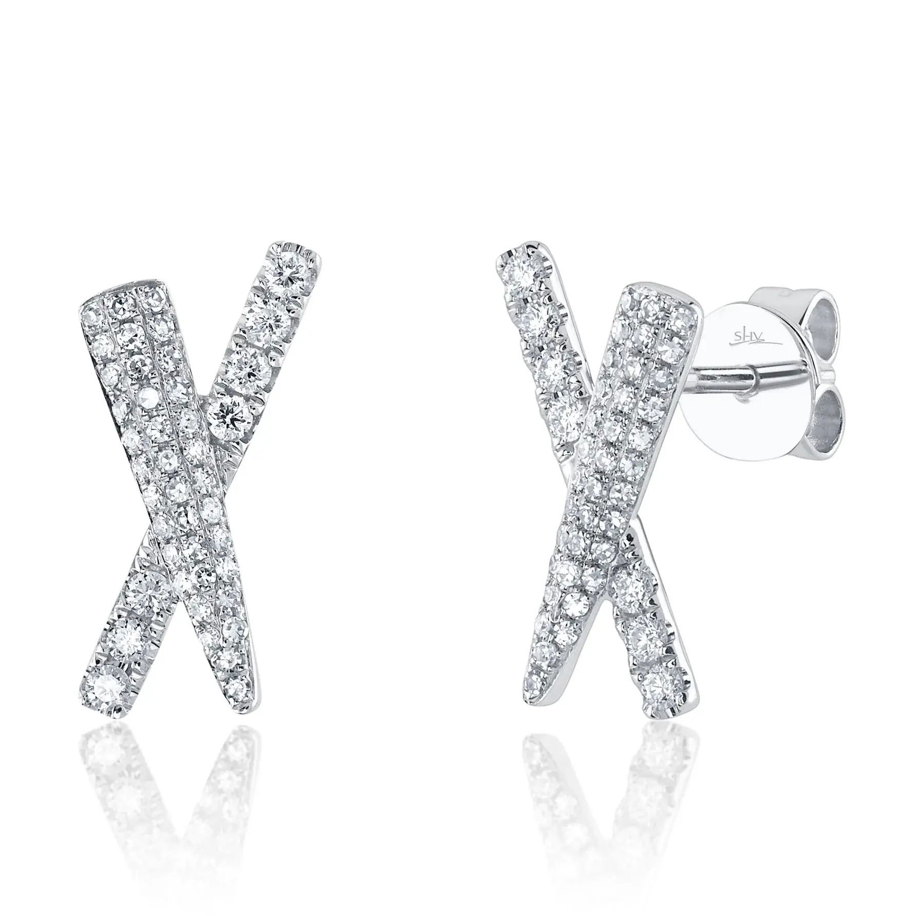 Dare to stand out with this bold and striking statement piece, perfect for making a lasting impression. All Shy Creation diamonds are natural and hand-selected. All stones are unique and hand set. As a result, you can expect slight variations in the shade, hue, tint of the color stones and stone count.-14k White gold-Round diamonds, 0.32ctsItem# 805-2000029 Diamond "X" Stud Earrings