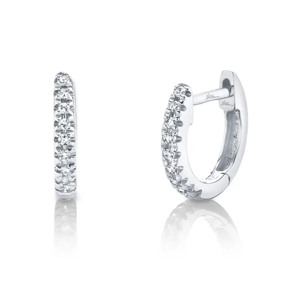 Sleek yet captivating, this minimalist piece is designed to draw attention. All Shy Creation diamonds are natural and hand-selected. All stones are unique and hand set. As a result, you can expect slight variations in the shade, hue, tint of the color stones and stone count.-14k White gold-Round diamonds, 0.04ctsItem# 805-2000047 Diamond Mini Huggie Earrings