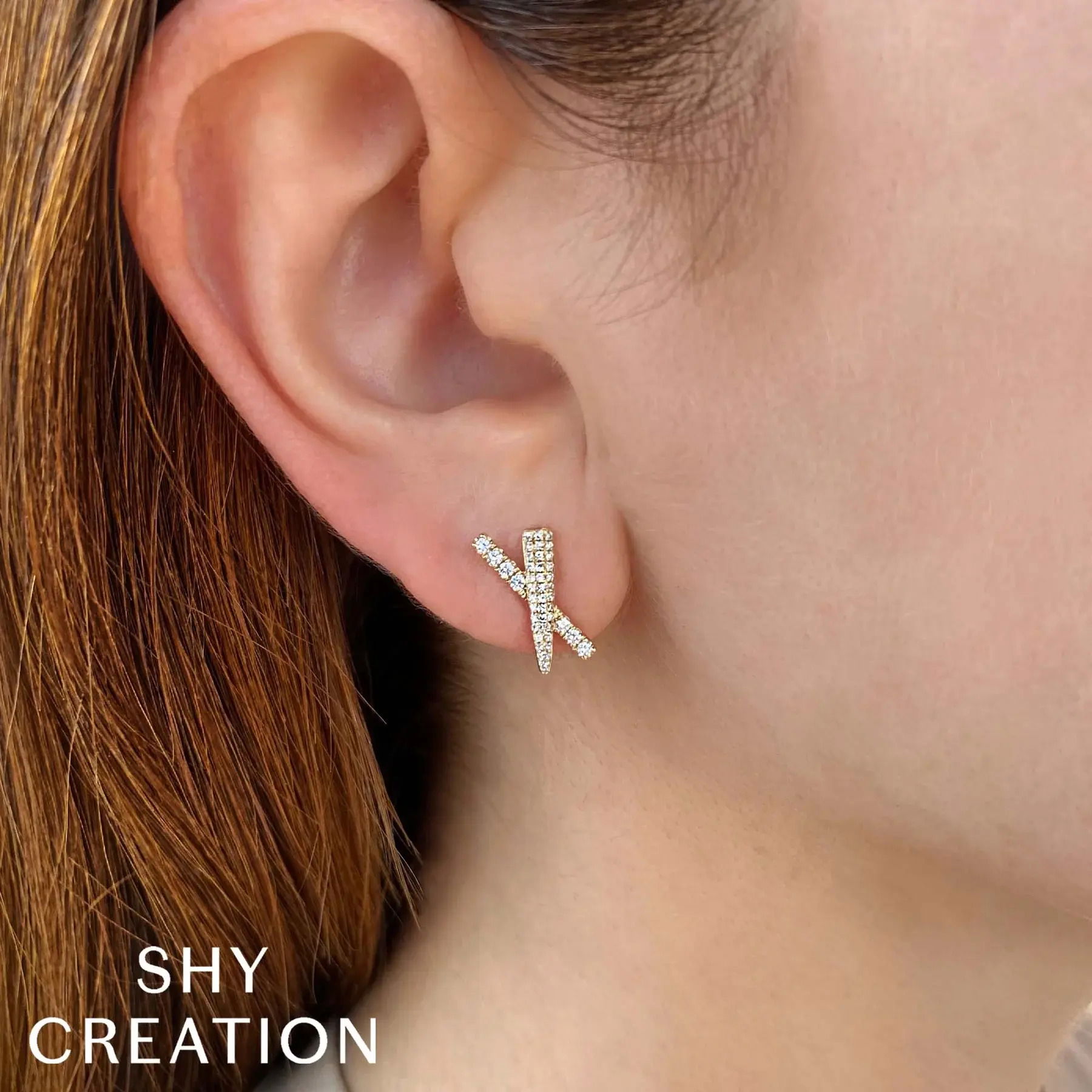 Dare to stand out with this bold and striking statement piece, perfect for making a lasting impression. All Shy Creation diamonds are natural and hand-selected. All stones are unique and hand set. As a result, you can expect slight variations in the shade, hue, tint of the color stones and stone count.-14k Yellow gold-Round diamonds, 0.16cts-Round diamonds, 0.16cts-Dimensions, 0.55"L / 0.30"WItem# 805-2000122 Diamond 'X' Stud Earrings
