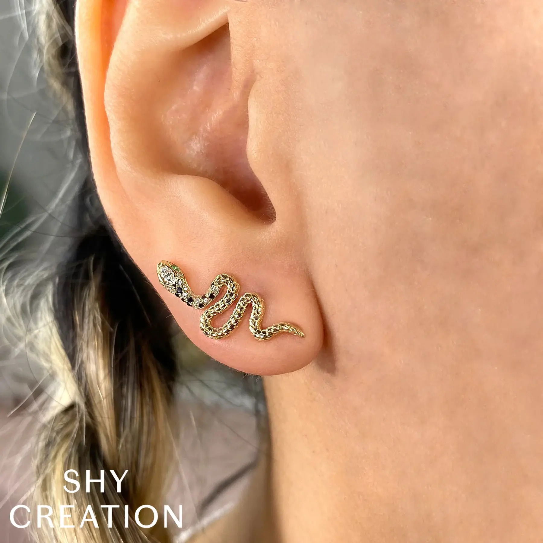 Minimalist in design but rich in impact, these studs will ensure all eyes are on you. All Shy Creation diamonds are natural and hand-selected. All stones are unique and hand set. As a result, you can expect slight variations in the shade, hue, tint of the color stones and stone count.-14k Yellow gold-Emerald, 0.04cts-Round diamonds, 0.10cts-Marquise diamonds, 0,06cts-Dimensions, 0.85"L / 0.35"WItem# 805-2000125 Black and White Diamond and Emerald Stud Earrings