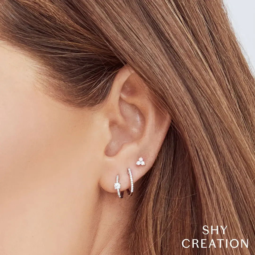 Your go-to accessory for any outfit, adding a touch of style from morning to midnight. All Shy Creation diamonds are natural and hand-selected. All stones are unique and hand set. As a result, you can expect slight variations in the shade, hue, tint of the color stones and stone count.-14k White gold-Round diamonds, 0.08cts-Dimensions, 0.80"L / 0.30"WItem# 805-2000163 Diamond Huggie Earrings