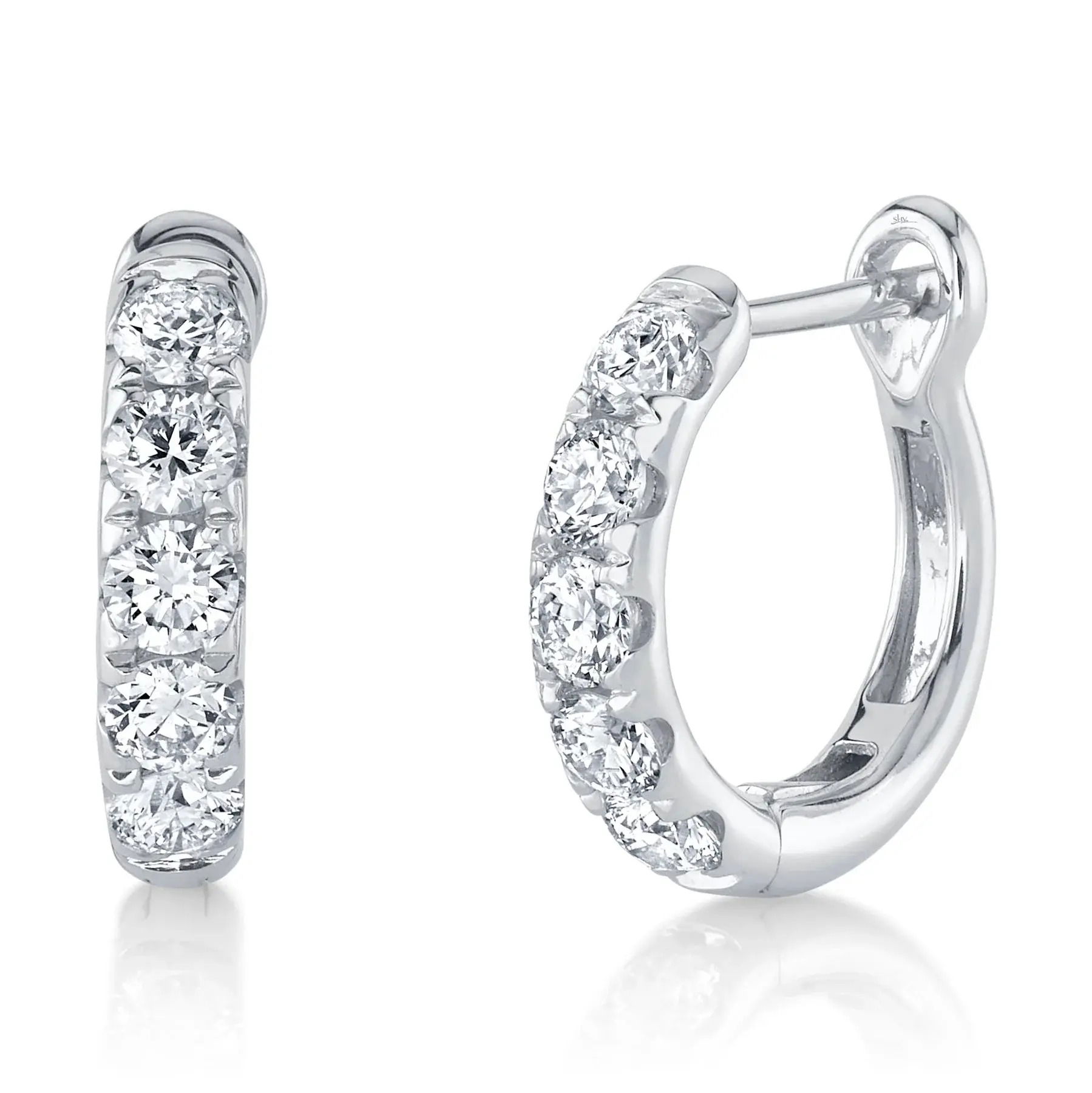 Subtle elegance that adds a refined touch to your everyday wear or special occasions. All Shy Creation diamonds are natural and hand-selected. All stones are unique and hand set. As a result, you can expect slight variations in the shade, hue, tint of the color stones and stone count. -14k White gold-Round diamonds, 0.81ctsItem# 805-2000206 Diamond Huggie Earrings