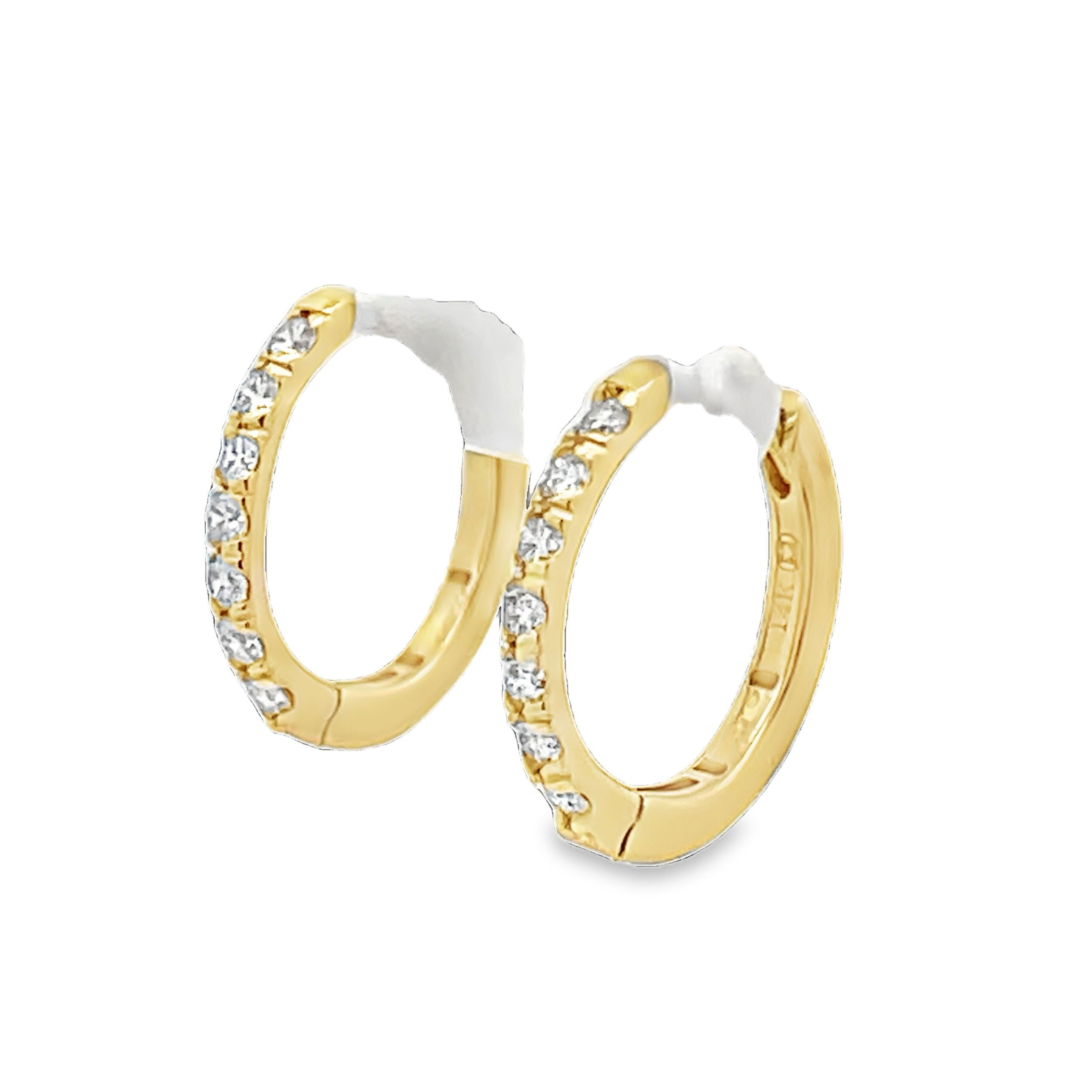 Simple yet striking, these yellow gold huggies with sparkling diamonds are a stunning addition to any jewelry collection, allowing you versatility within your style. -14k Yellow gold-Round diamonds, 0.51ctsItem# 805-2000217 Diamond Huggies