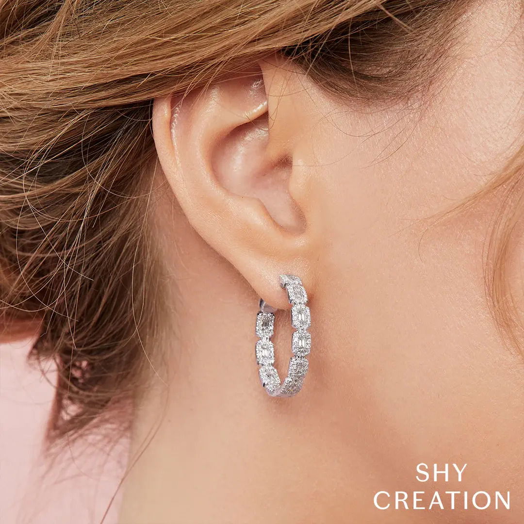 A perfect piece to add a touch of sparkle to any casual or formal outfit. All Shy Creation diamonds are natural and hand-selected. All stones are unique and hand set. As a result, you can expect slight variations in the shade, hue, tint of the color stones and stone count.-14k Yellow gold-Round diamonds, 0.74cts-Baguette diamonds, 0.61ctsItem# 805-2000220 Diamond Baguette Hoop Earrings