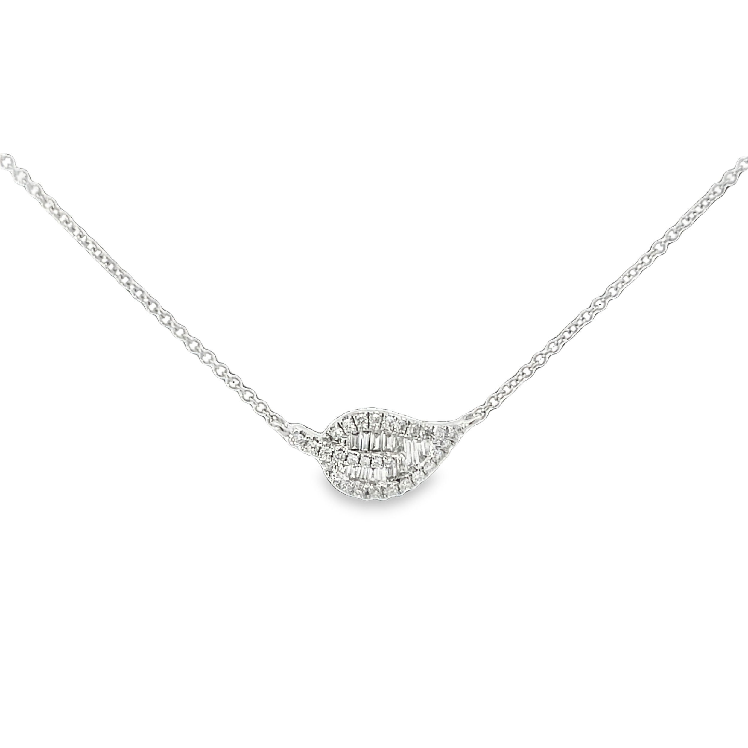 Graceful and refined, this stationary diamond leaf pendant captures the delicate beauty of nature. Sparkling diamonds trace the gentle curves of the leaf, creating a timeless piece that adds effortless elegance to any look. Perfect for any plant lover!-14K White gold-Baguette diamonds, 0.11cts-Round diamonds, 0.17cts-Length 16"-18"Item# 807-2000101 Diamond Leaf Necklace