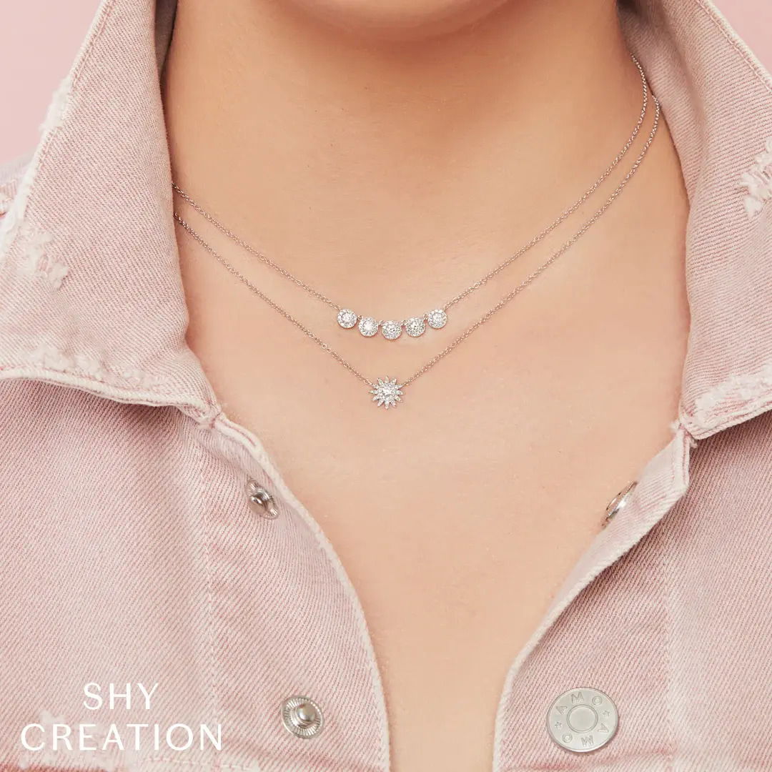 This versatile piece effortlessly transitions from day to night, adding subtle elegance to every moment. All Shy Creation diamonds are natural and hand-selected. All stones are unique and hand set. As a result, you can expect slight variations in the shade, hue, tint of the color stones and stone count.-14k White gold-Round diamonds, 0.15cts-Dimensions, 0.35"L / 0.35"W -Chain length, 15"-18"Item# 807-2000110 Diamond Starburst Necklace