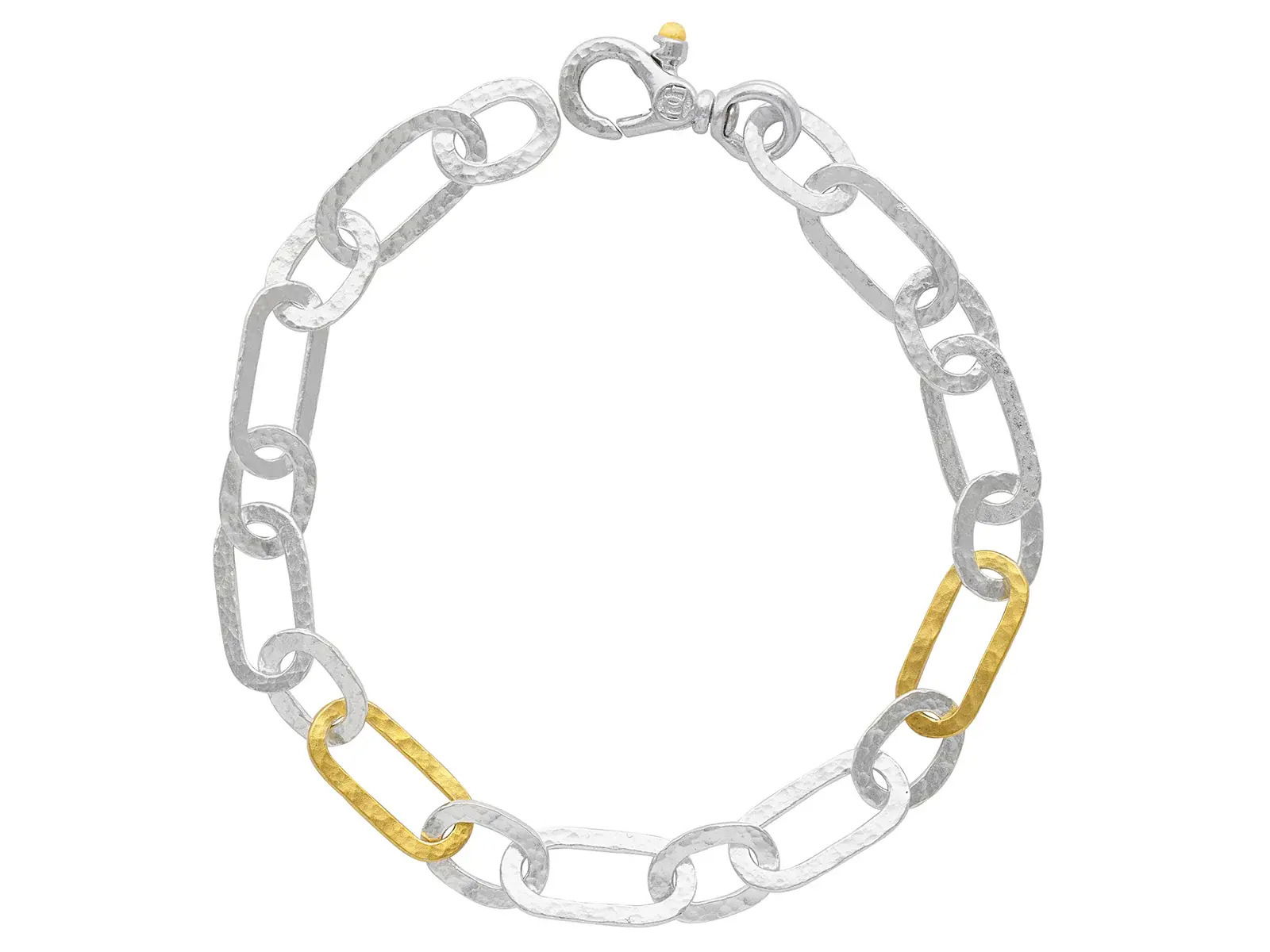 This chain bracelet combines 24k yellow gold and sterling silver for a refined two-tone design. Its timeless style adds a touch of sophistication to any outfit.-Sterling silver-24k Yellow gold-Length 7"Item# 002-808-2000077 Chain Bracelet