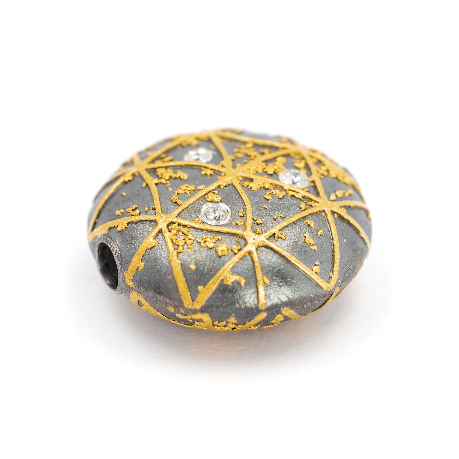 Functional art in its purest form. This clasp in oxidized sterling silver and 24k gold, is a mechanical innovation disguised as wearable sculpture. Designed to connect with Atelier Zobel’s modular Vario chains.-Sterling silver & 24k yellow gold-Round diamonds, 0.06ctsItem# 811-00243 Round Vario Clasp