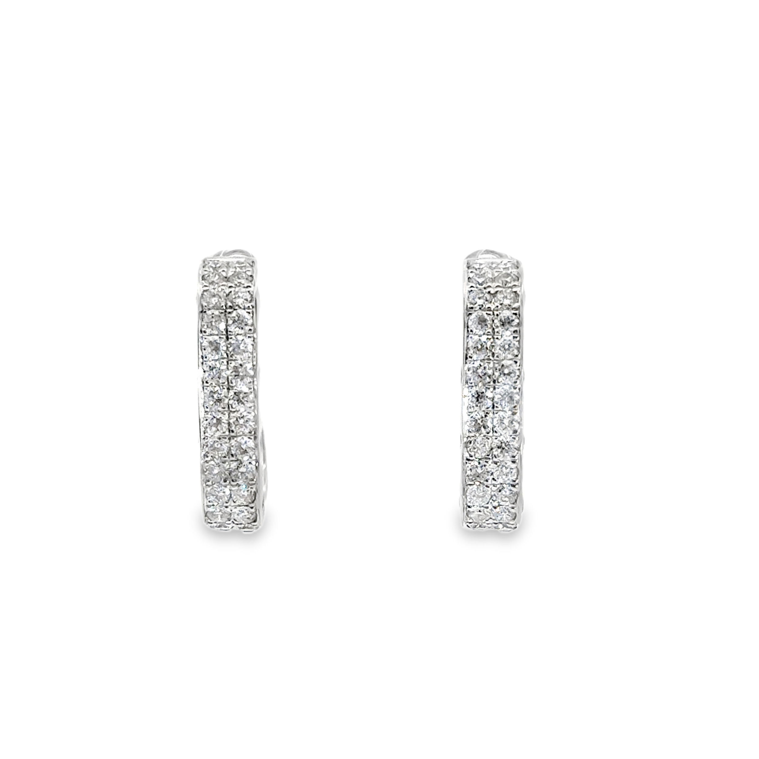 These square hoops offer a modern twist on a classic silhouette. Crafted with clean angles and adorned with pave-set diamonds, they deliver bold sparkle and contemporary elegance—perfect for elevating any look.-14k White gold-Round diamonds, 1.05ctsItem# 150-01597 Square Pave Set Hoops