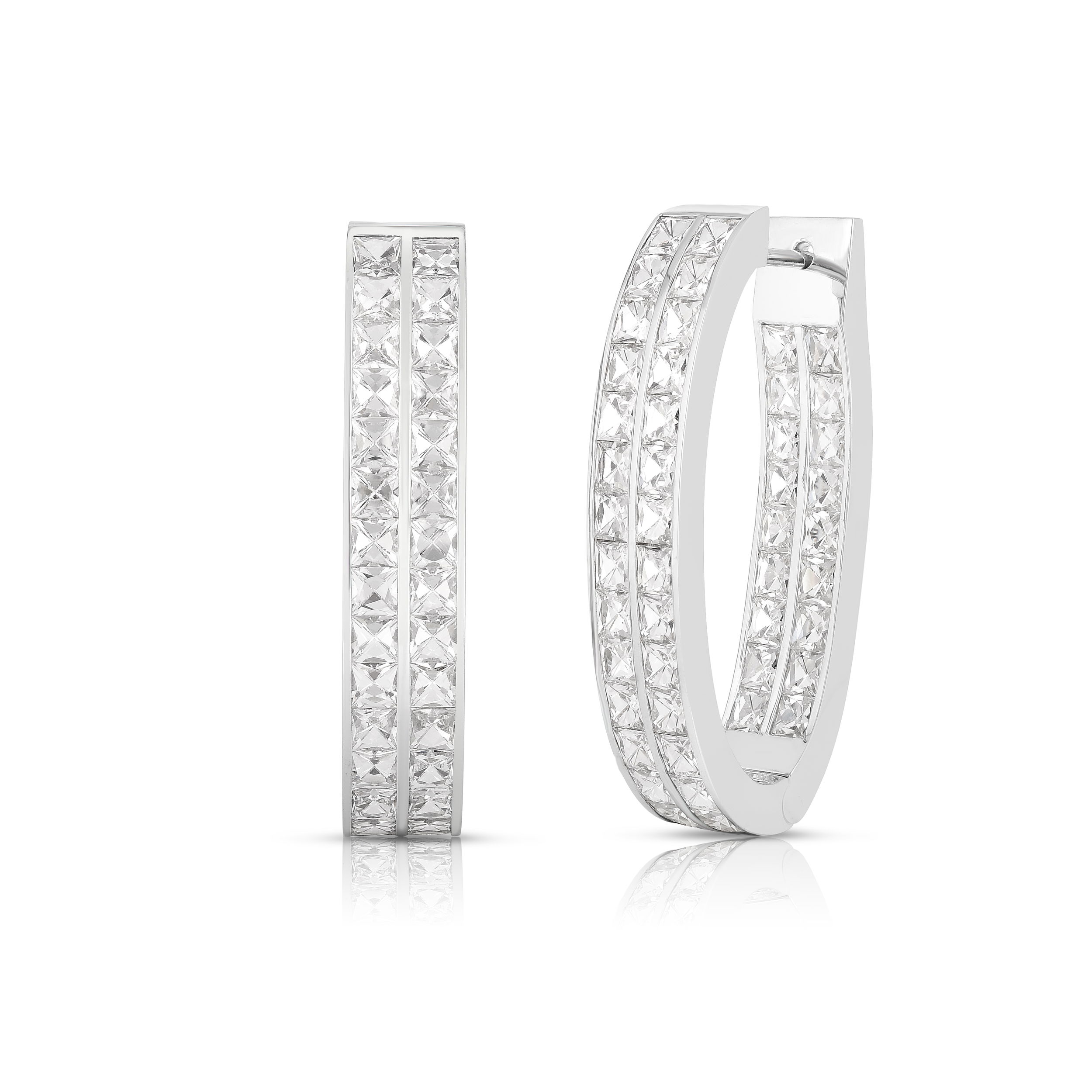 These double row elongated hoops offer brilliant sparkle promising attention to the wearer. Cicada atelier is located in the heart of the New York City jewelry district on 47th street, where each unique piece is meticulously handcrafted.-18K White gold-Square cut diamonds, 9.32ctsItem# 150-01841 Diamond Hoop Earrings