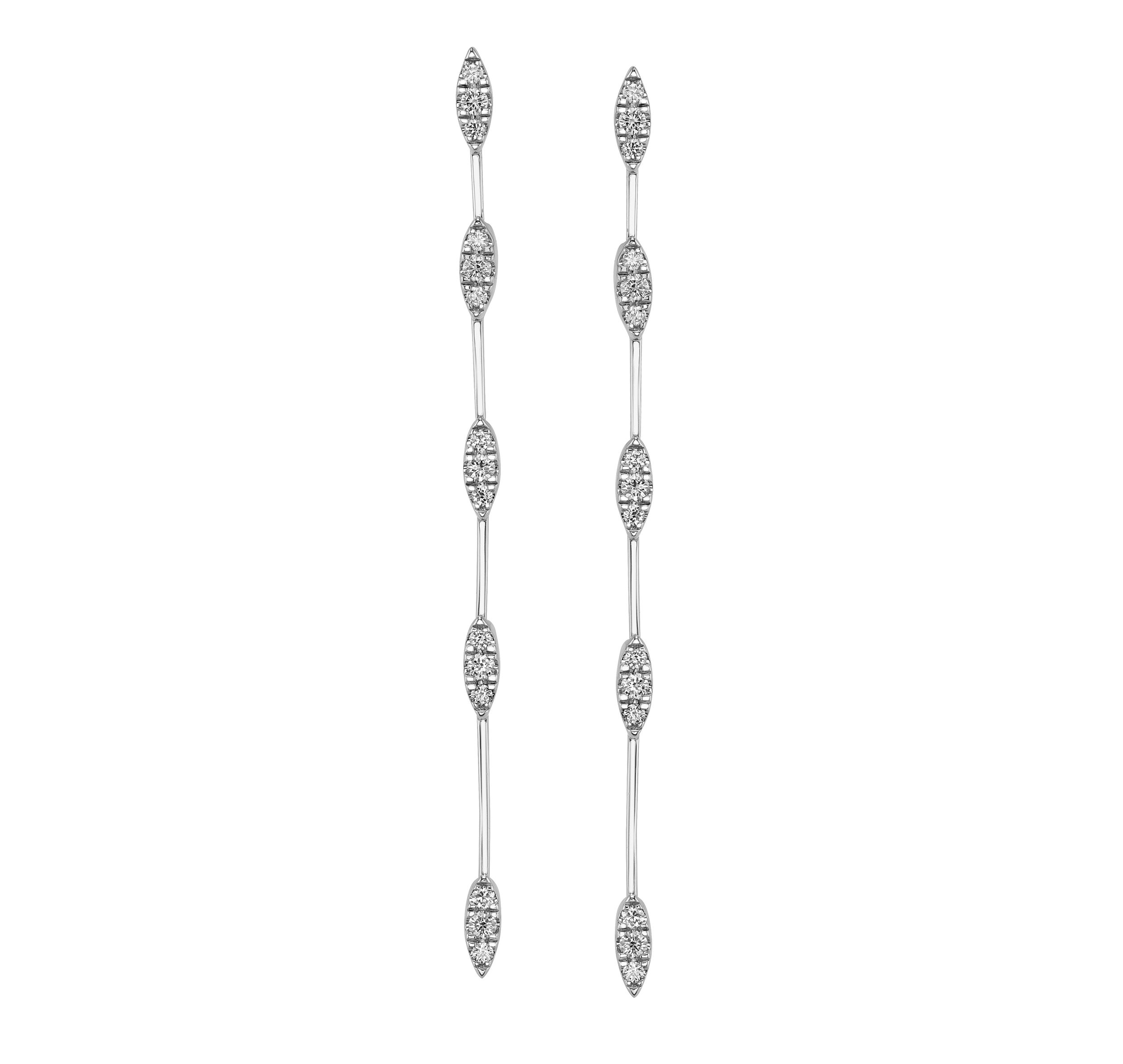 These 14k white gold line earrings feature five marquise diamond stations, creating an elegant, elongated silhouette. Delicate yet eye-catching, they add just the right amount of sparkle for everyday wear or special occasions.-14k White gold-Marquise diamonds, 0.66ctsItem# ER-332 Cascade Earrrings