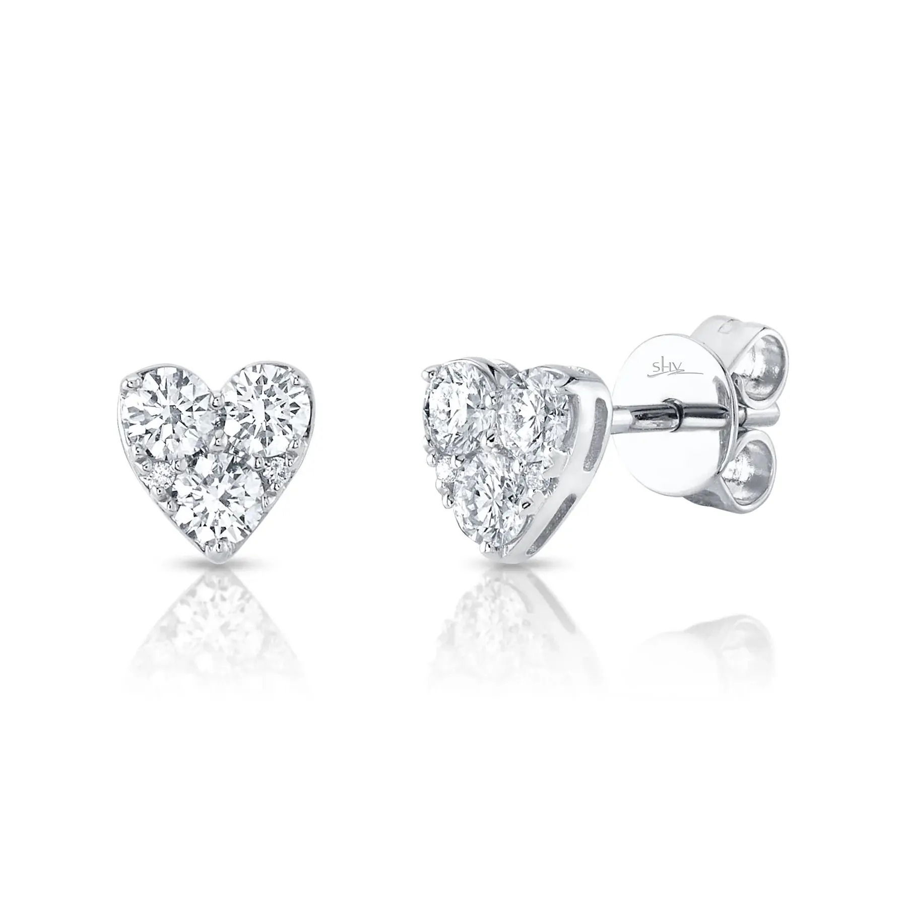 Classy and timeless, this piece offers fashion-forward elegance that will enhance your collection for years to come. All Shy Creation diamonds are natural and hand-selected. All stones are unique and hand set. As a result, you can expect slight variations in the shade, hue, tint of the color stones and stone count.-14k White gold-Round diamonds, 0.51cts-Dimensions, 0.25"L / 0.25"WItem# 805-2000227 Diamond Heart Stud Earrings
