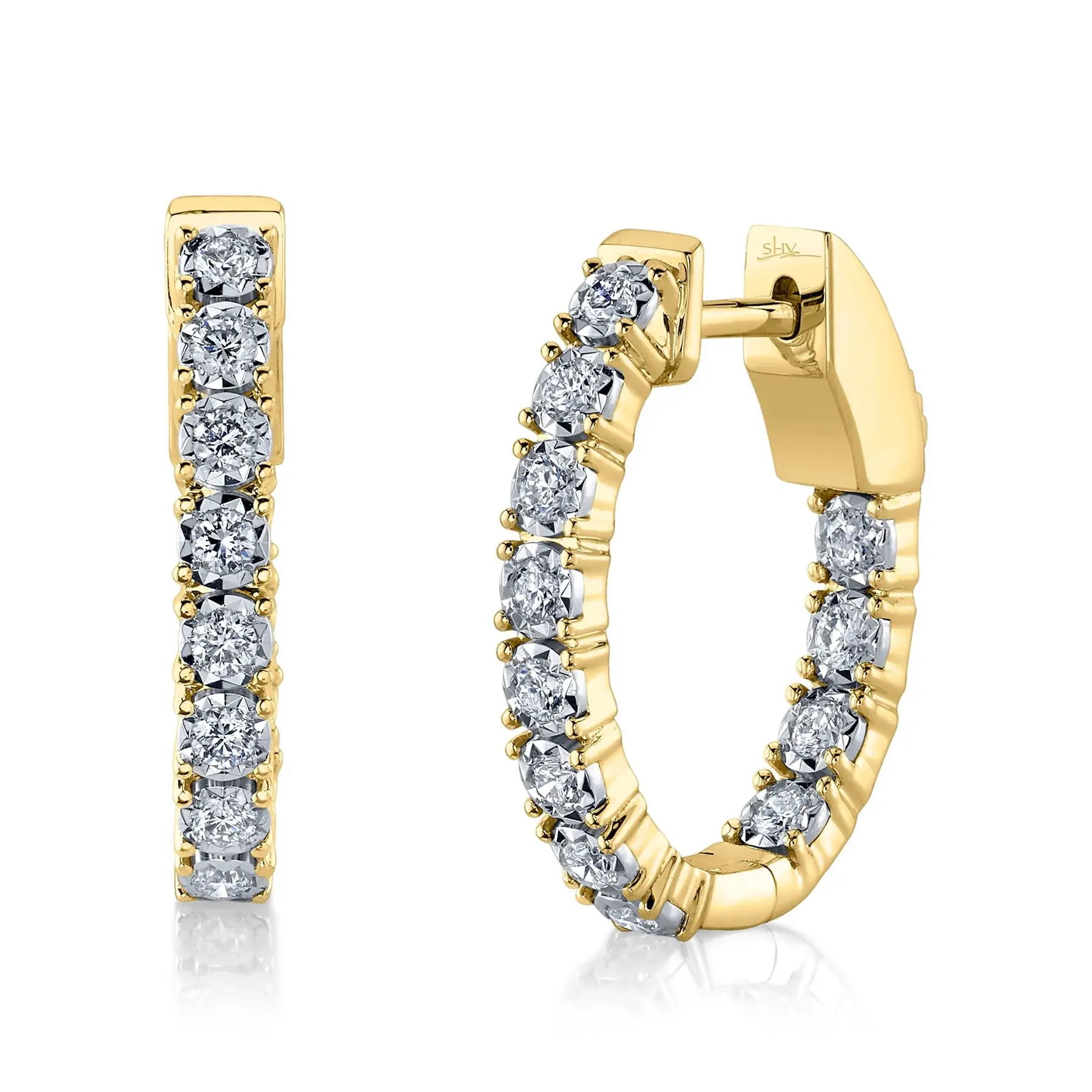 This versatile piece effortlessly transitions from day to night, adding subtle elegance to every moment. Shy Creation diamonds are natural and hand-selected. All stones are unique and hand set. As a result, you can expect slight variations in the shade, hue, tint of the color stones and stone count.-14k Yellow gold-Round diamonds, 0.47ctsItem# 805-2000230 Diamond Oval Hoop Earring