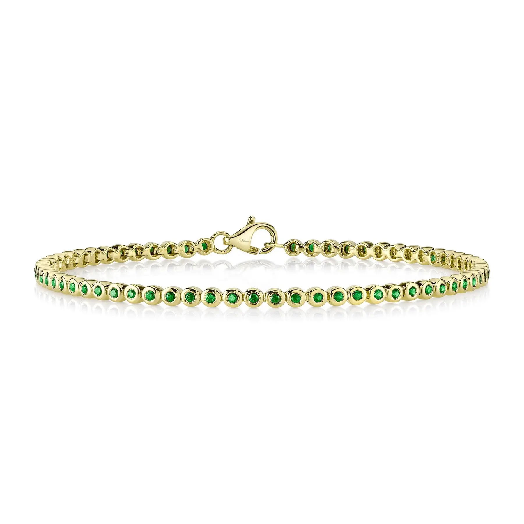 A timeless piece that elevates both casual and formal outfits, perfect for any occasion. The stones are in a sleek bezel setting for everyday wear. -14k Yellow gold-Emeralds, 0.62cts-Dimensions, 0.10"W-Size SItem# 808-2000125 Emerald Bezel Tennis Bracelet