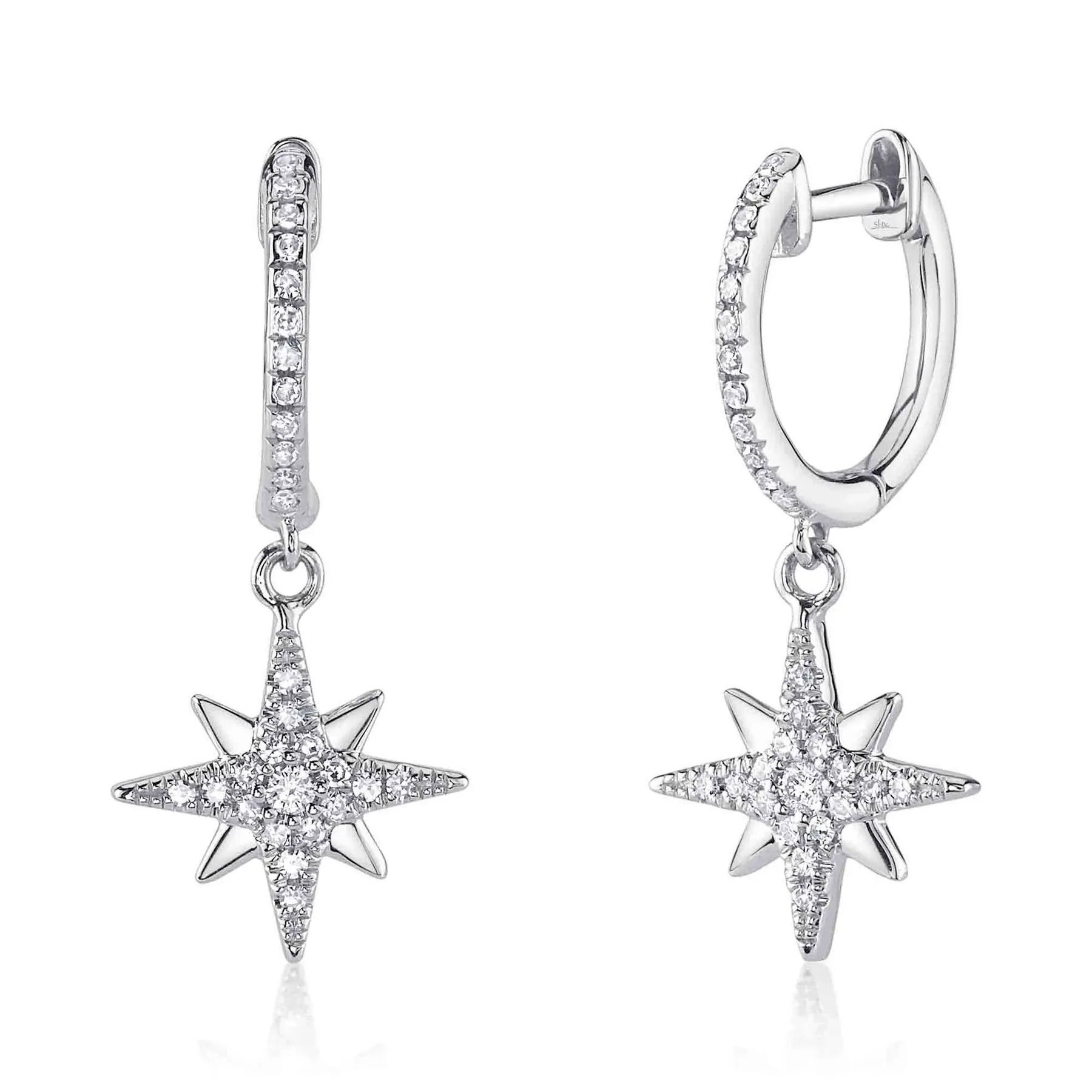 A sleek design with a bold presence that effortlessly commands attention. All Shy Creation diamonds are natural and hand-selected. All stones are unique and hand set. As a result, you can expect slight variations in the shade, hue, tint of the color stones and stone count.-14k White gold-Round diamonds, 0.19cts-Dimensions, 0.90"L / 0.4"WItem# 805-2000250 Diamond North Star Earrings