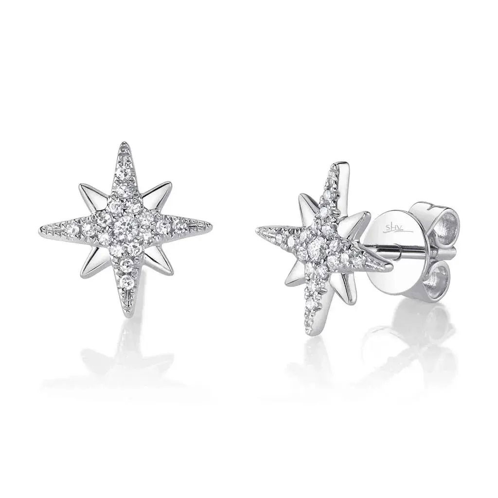 A sleek design with a bold presence that effortlessly commands attention. All Shy Creation diamonds are natural and hand-selected. All stones are unique and hand set. As a result, you can expect slight variations in the shade, hue, tint of the color stones and stone count.-14k White gold-Round diamonds, 0.19cts-Dimensions, 0.90"L / 0.4"WItem# 805-2000250 Diamond North Star Earrings