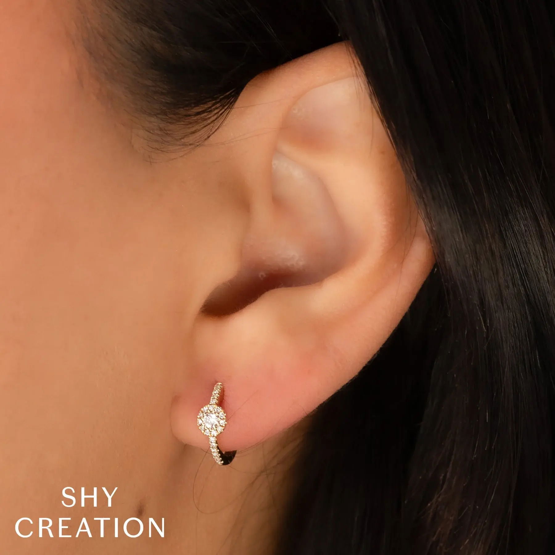 This versatile piece is the ideal accent piece or statement on its own, perfect for any collection. All Shy Creation diamonds are natural and hand-selected. All stones are unique and hand set. As a result, you can expect slight variations in the shade, hue, tint of the color stones and stone count.-14k White gold-Round diamonds, 0.21cts-Dimensions, 0.45"L / 0.20"WItem# 805-2000251 Diamond Huggie Earrings