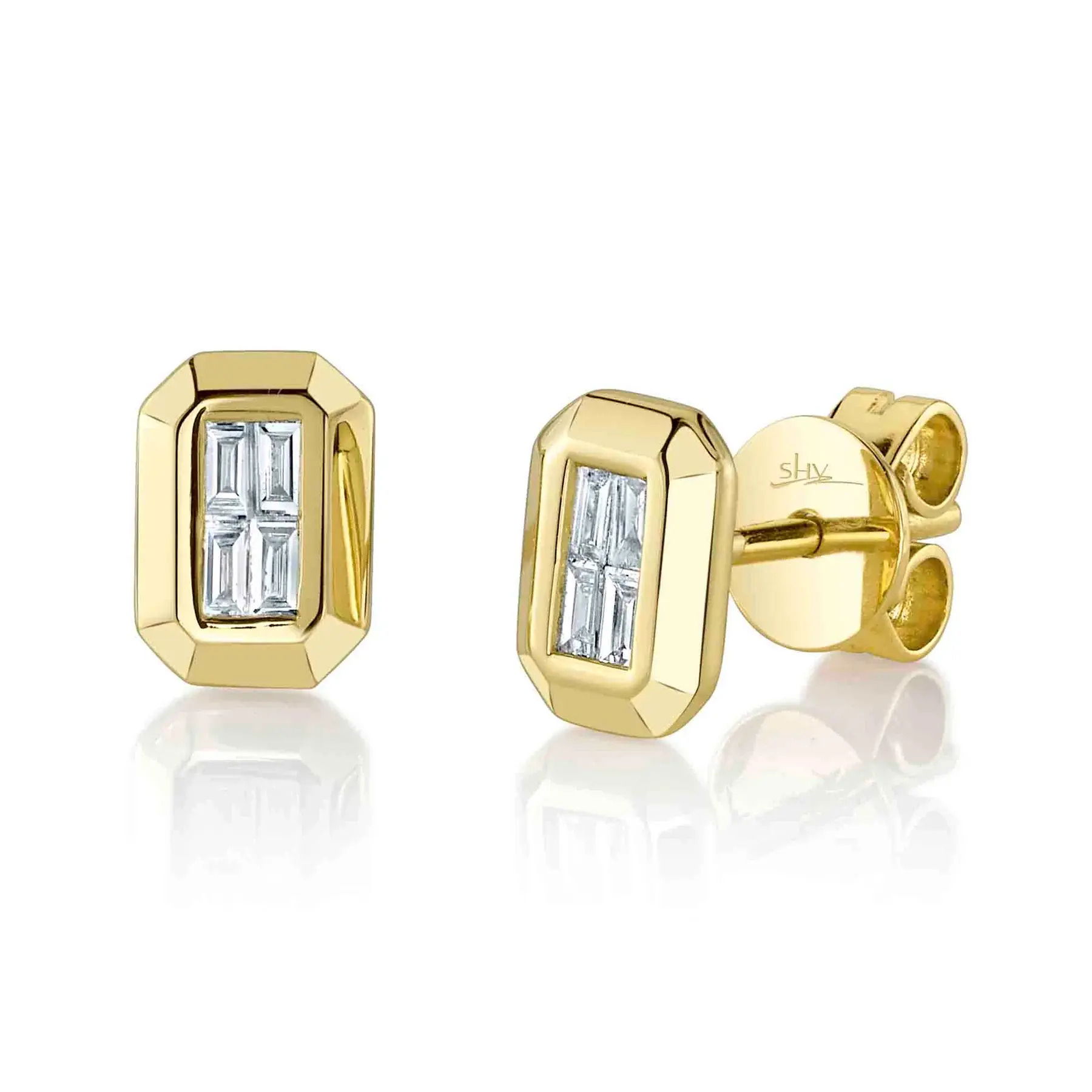 This piece transitions seamlessly from day to night, adding elegance to any outfit. All Shy Creation diamonds are natural and hand-selected. All stones are unique and hand set. As a result, you can expect slight variations in the shade, hue, tint of the color stones and stone count.-14k Yellow gold-Baguette diamonds, 0.14cts-Dimensions, 0.30"L / 0.20"WItem# 805-2000260 Diamond Baguette Geo Cut Stud Earrings