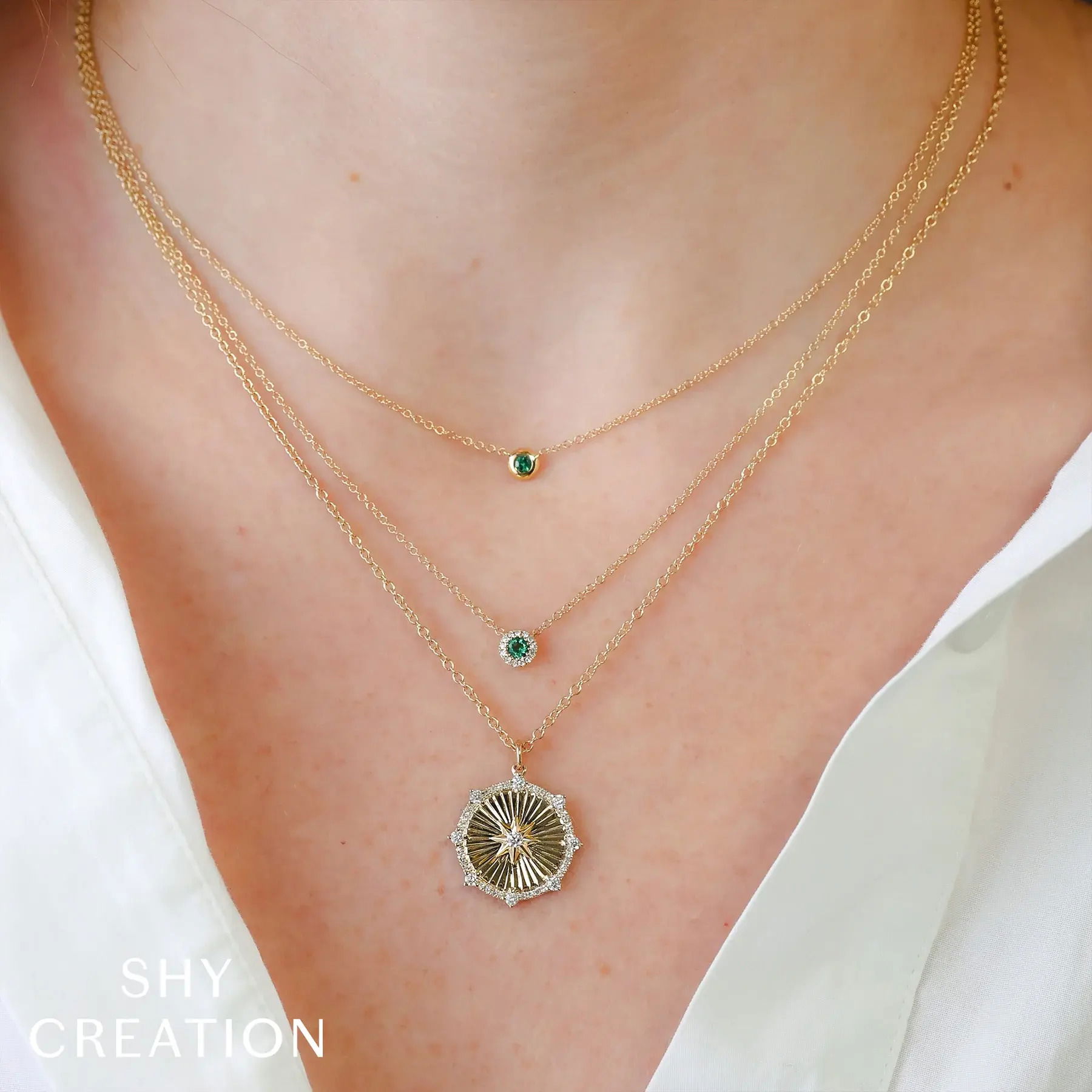 Elevate your style with this timeless piece, made to complement any wardrobe. All Shy Creation diamonds are natural and hand-selected. All stones are unique and hand set. As a result, you can expect slight variations in the shade, hue, tint of the color stones and stone count.-14k Yellow gold-Emerald, 0.04ct-Chain length, 15"-18"Item# 807-2000152 Emerald Bezel Necklace