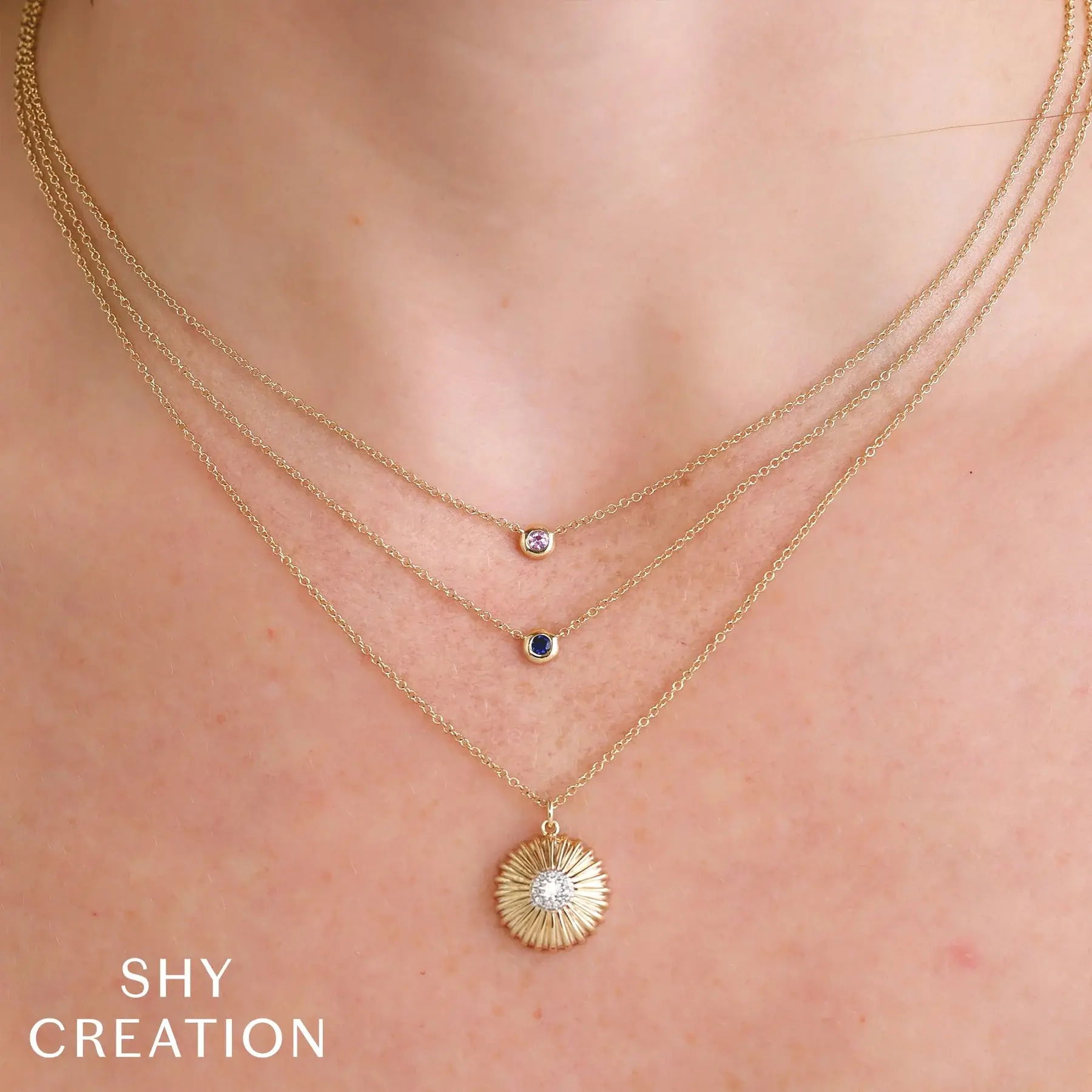 Elevate your style with this timeless piece, made to complement any wardrobe. All Shy Creation diamonds are natural and hand-selected. All stones are unique and hand set. As a result, you can expect slight variations in the shade, hue, tint of the color stones and stone count.-14k Yellow gold-Pink sapphire, 0.07ct-Chain length, 15"-18"Item# 807-2000155 Pink Sapphire Bezel Necklace