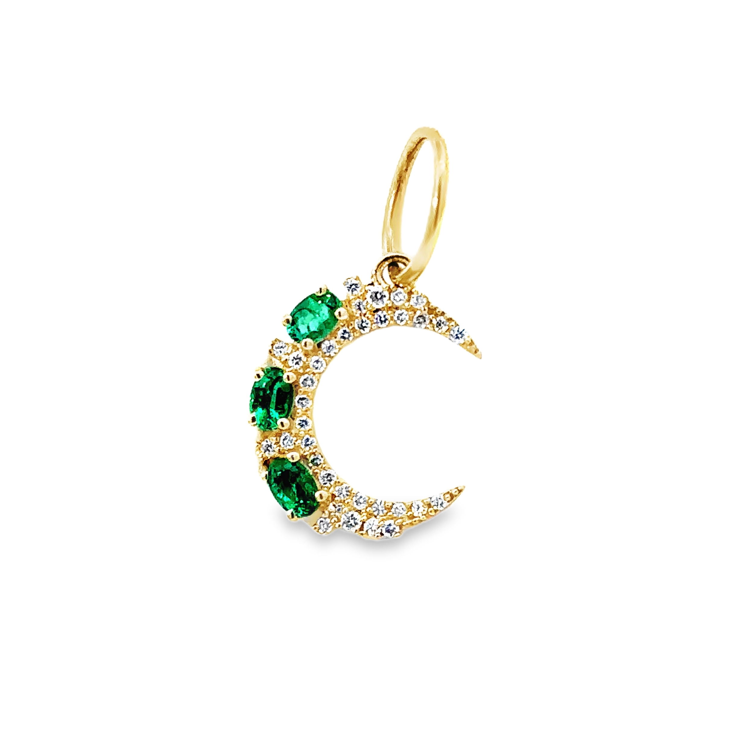 This emerald and diamond crescent moon pendant features vibrant emeralds along its curve, beautifully complemented by shimmering diamonds. A perfect blend of rich color and sparkling elegance, it adds a celestial-inspired touch to any jewelry collection.-14k Yellow gold-Oval green emeralds, 0.18cts-Round white diamonds, 0.09ctsItem# 806-2000062 Emerald & Diamond Crescent Moon Pendant