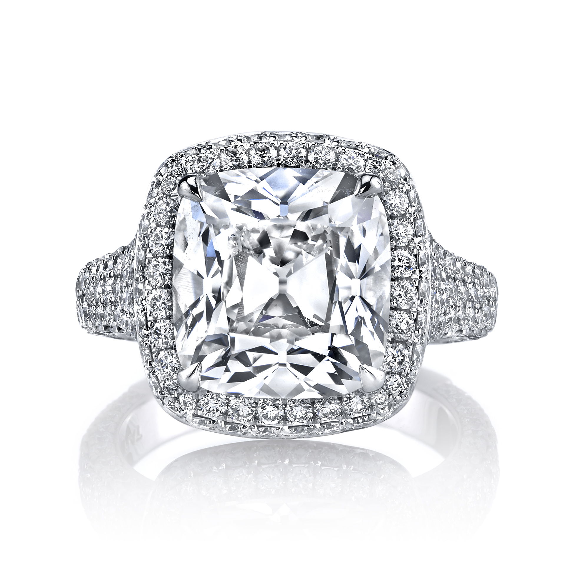An exceptional cushion-cut diamond engagement ring radiates timeless elegance. The micro-pave set diamond halo and shank add exquisite brilliance, creating a sparkling frame that highlights the center stone. Designed for those seeking sophistication and lasting beauty, this ring is a perfect symbol of your love and commitment.-Platinum-Cushion diamond, 7.09cts-Round diamonds, 2.15cts-Size 6.5, Contact for sizing optionsItem# 100-2000012 Cushion Engagement Ring