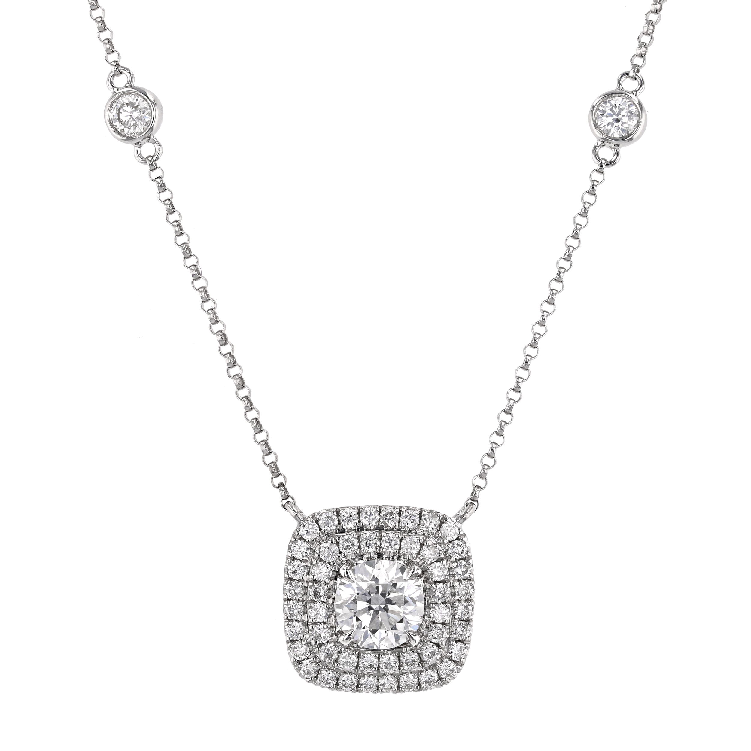 This french pave halo pendant features a dazzling round center diamond surrounded by two rows of shimmering diamonds radiating elegance. The layered halo design enhances brilliance and adds depth, creating a stunning focal point that's perfect for any occasion.-18k White gold-Round diamond, 0.99cts-Round diamonds, 1.19cts-Length 16-17" on adjustable chainItem# 165-2000021 Cushion Halo Pendant