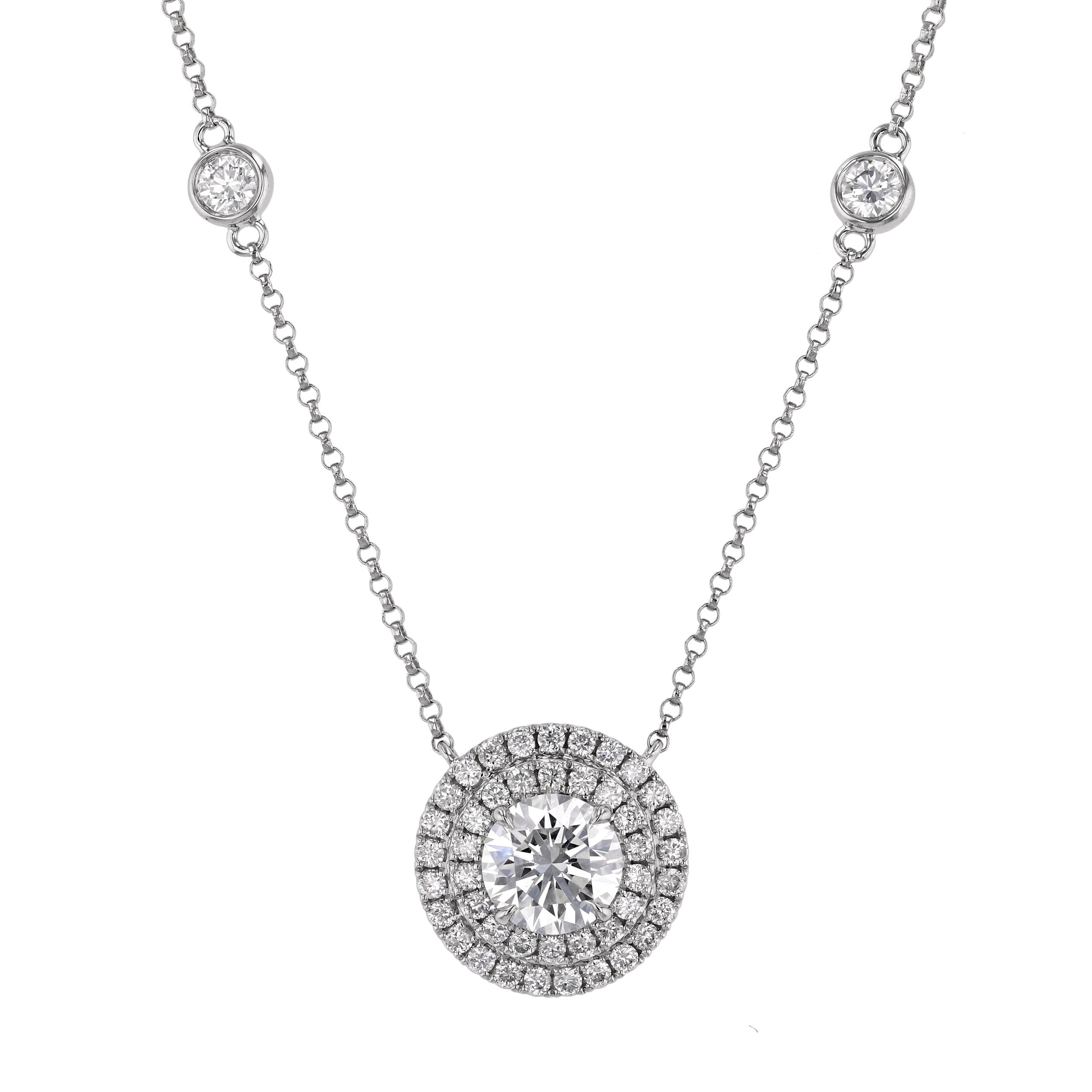 This french pave halo pendant features a dazzling round center diamond surrounded by two rows of shimmering diamonds radiating elegance. The layered halo design enhances brilliance and adds depth, creating a stunning focal point that's perfect for any occasion.-18k White gold-Round diamond, 0.90cts-Round diamonds, 1.13cts-Length 16-17" on adjustable chainItem# 165-2000023 Round Double Halo Pendant