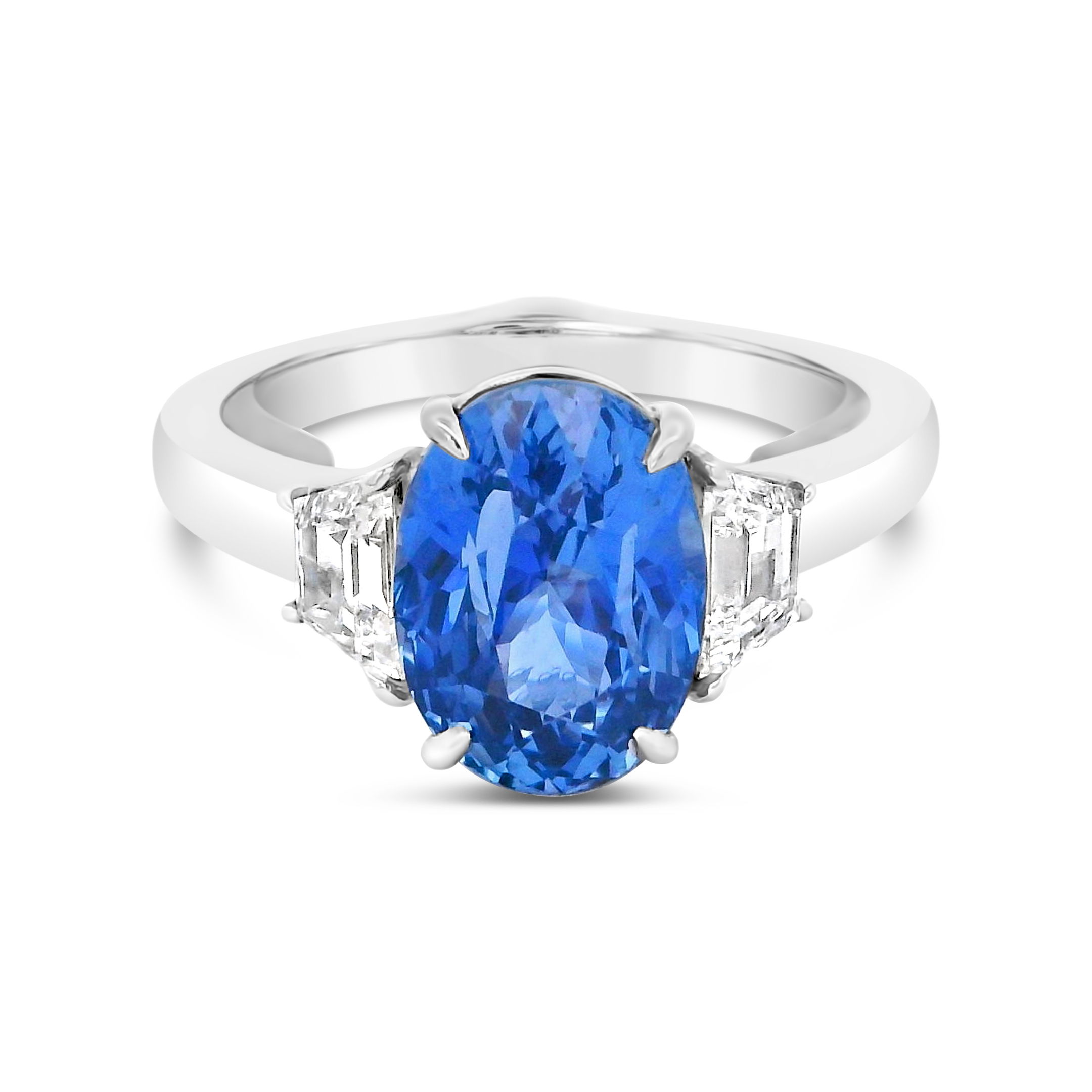 This platinum ring features a striking sapphire centerpiece, flanked by two radiant diamonds on each side. With its bold design and refined detail, this piece embodies timeless elegance.-Platinum-Sapphire, 4.11ct-Diamonds-Size 6.75Item# 200-2000030 Blue Sapphire and Diamond Ring