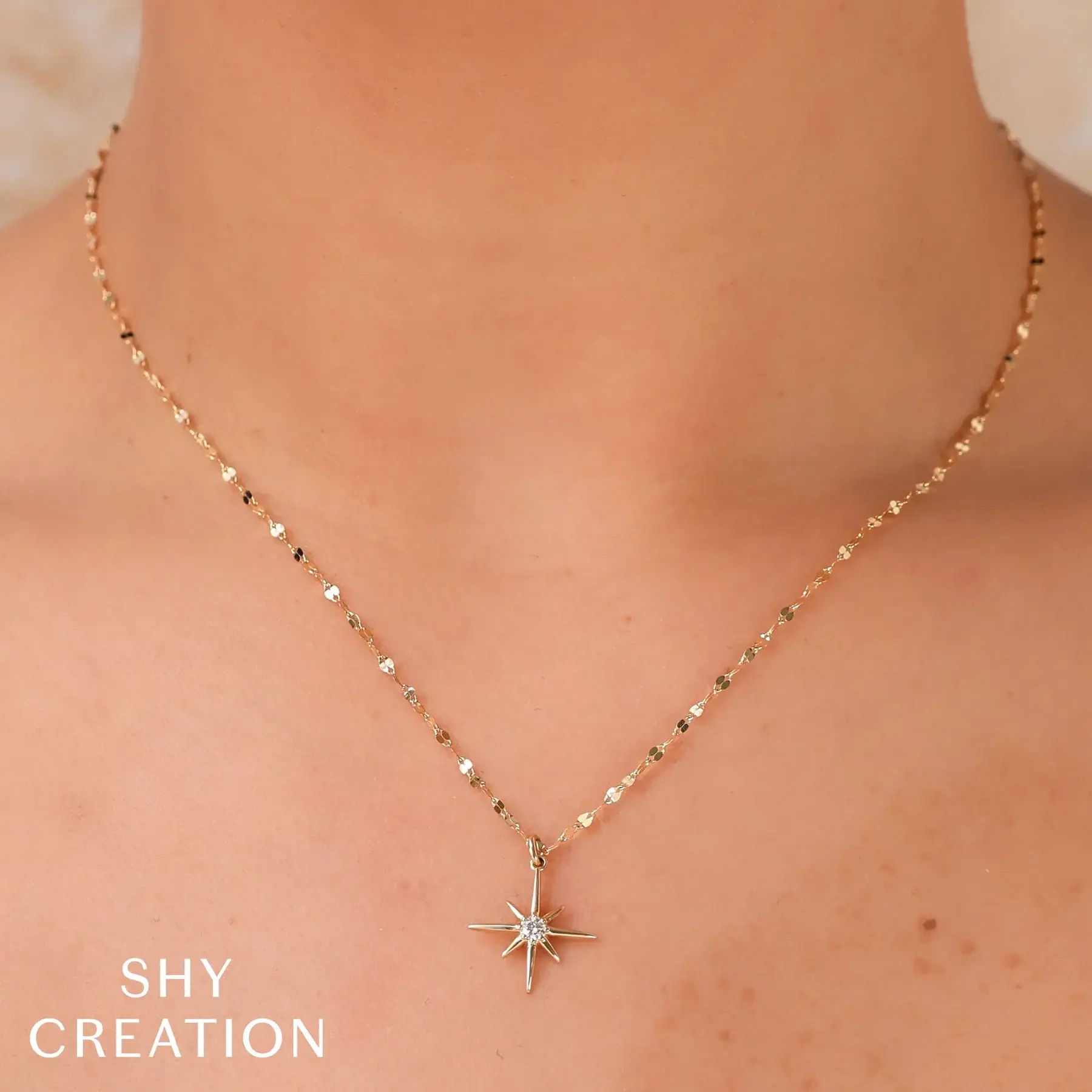 This piece transitions seamlessly from day to night, adding elegance to any outfit. All Shy Creation diamonds are natural and hand-selected. All stones are unique and hand set. As a result, you can expect slight variations in the shade, hue, tint of the color stones and stone count.-14k Yellow gold-Round diamonds, 0.08ctsItem# 807-2000162 Diamond North Star Necklace