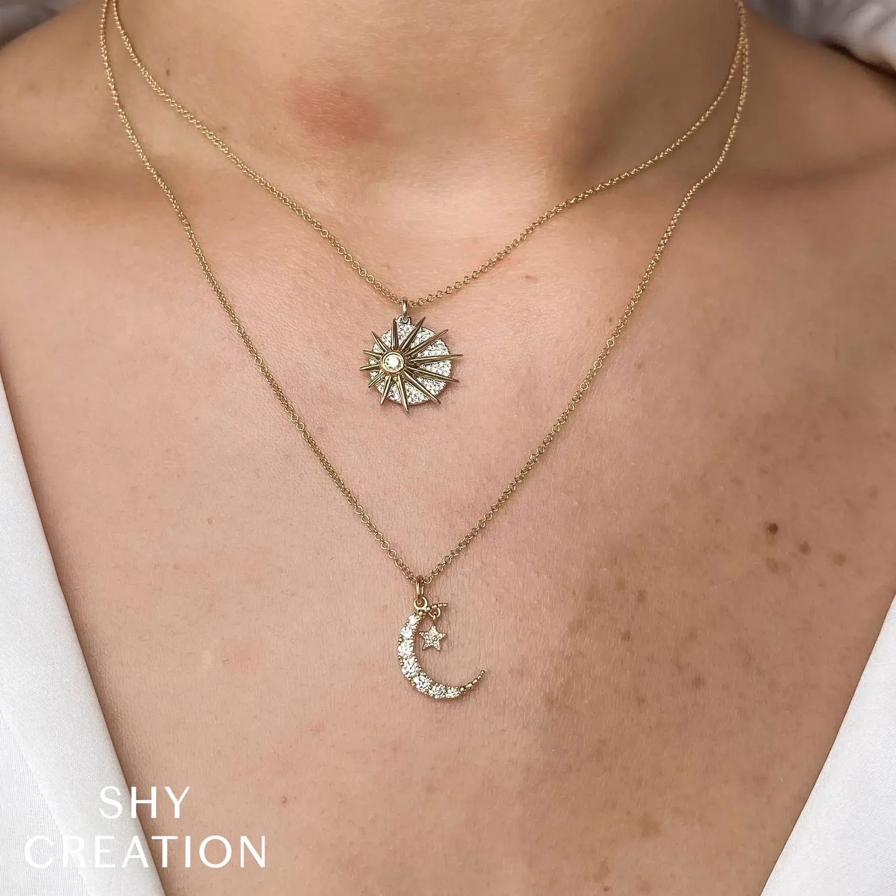 Add a touch of sparkle and elegance to your ensemble with this radiant and sophisticated piece. All Shy Creation diamonds are natural and hand-selected. All stones are unique and hand set. As a result, you can expect slight variations in the shade, hue, tint of the color stones and stone count.-14k Yellow & white gold-Round diamonds, 0.18cts-Chain length, 15"-18" on adjustable chainItem# 807-2000164 Diamond Sun Necklace