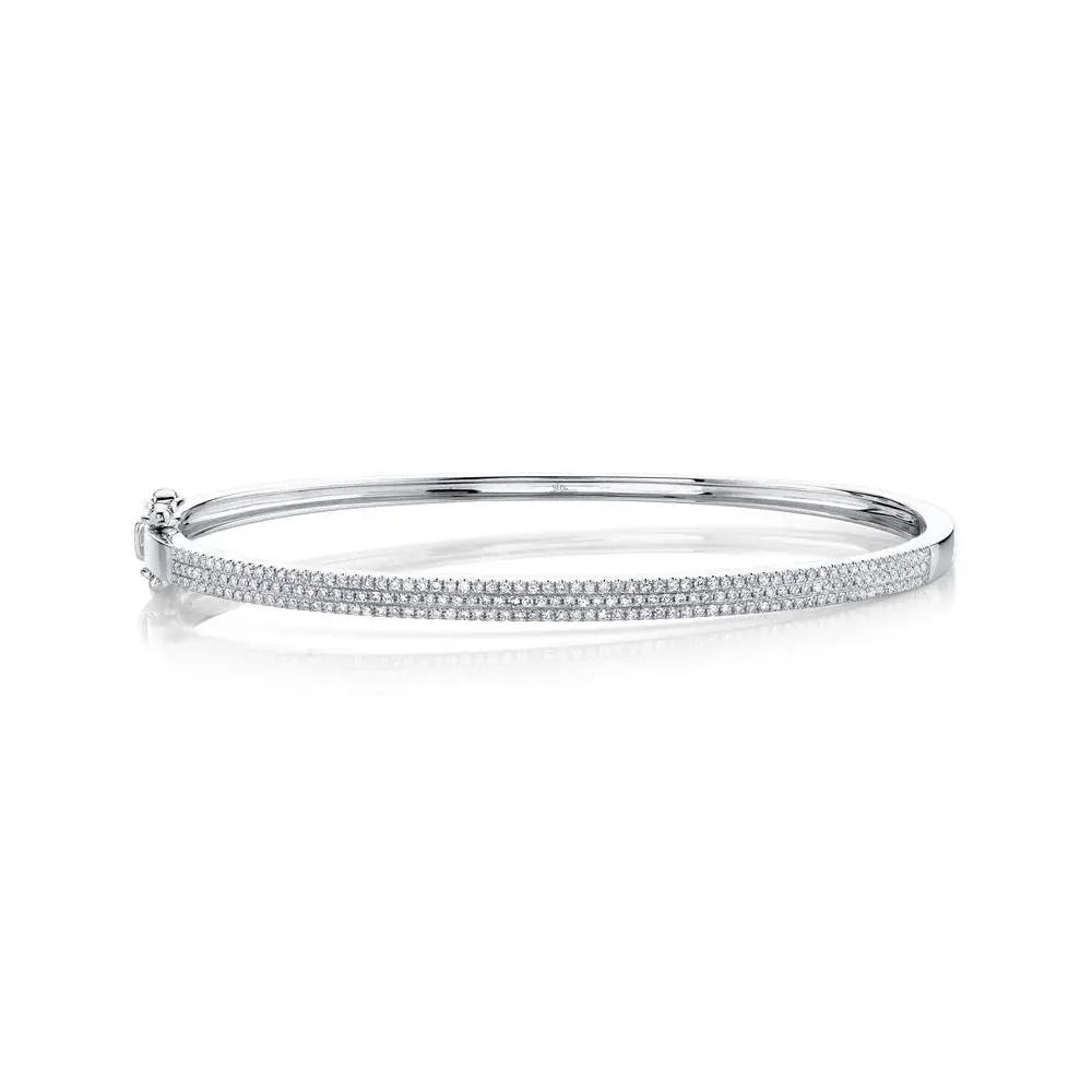 This simple yet flawless piece delivers effortless style, making it perfect for everyday wear. All Shy Creation diamonds are natural and hand-selected. All stones are unique and hand set. As a result, you can expect slight variations in the shade, hue, tint of the color stones and stone count.-14k White gold-Round diamonds, 0.52cts-Size SItem# 808-2000134 Diamond Pave Bangle