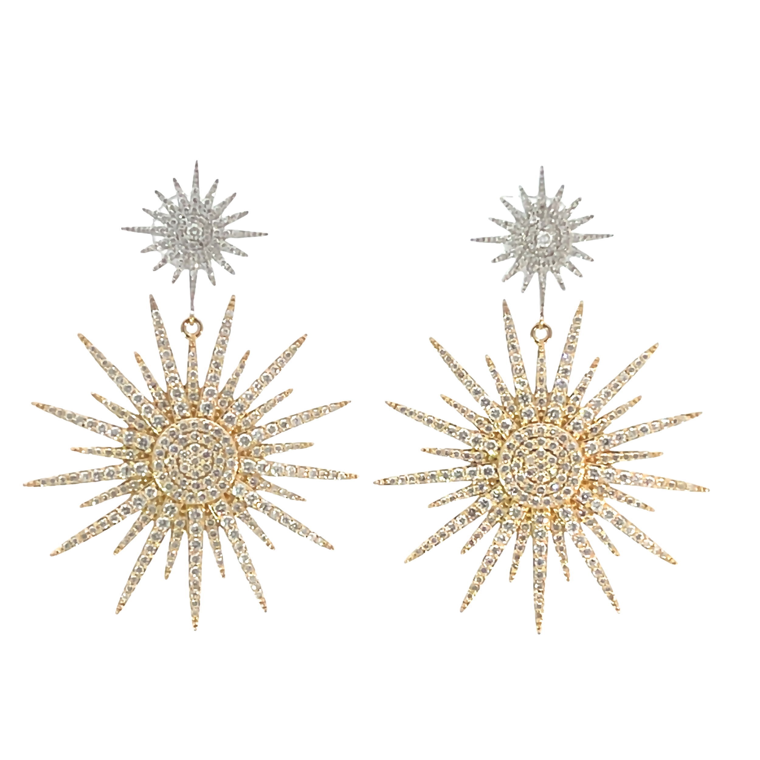 These earrings feature a radiant starburst design with pave diamonds, combining warm and cool tones for a striking effect. The intricate detailing and shimmering diamonds create a bold yet elegant look, perfect for elevating any outfit.-14k White gold-14k Yellow gold-Round white diamonds, 2.76ctsItem# 805-2000267 Two-Tone Starburst Drop Earrings
