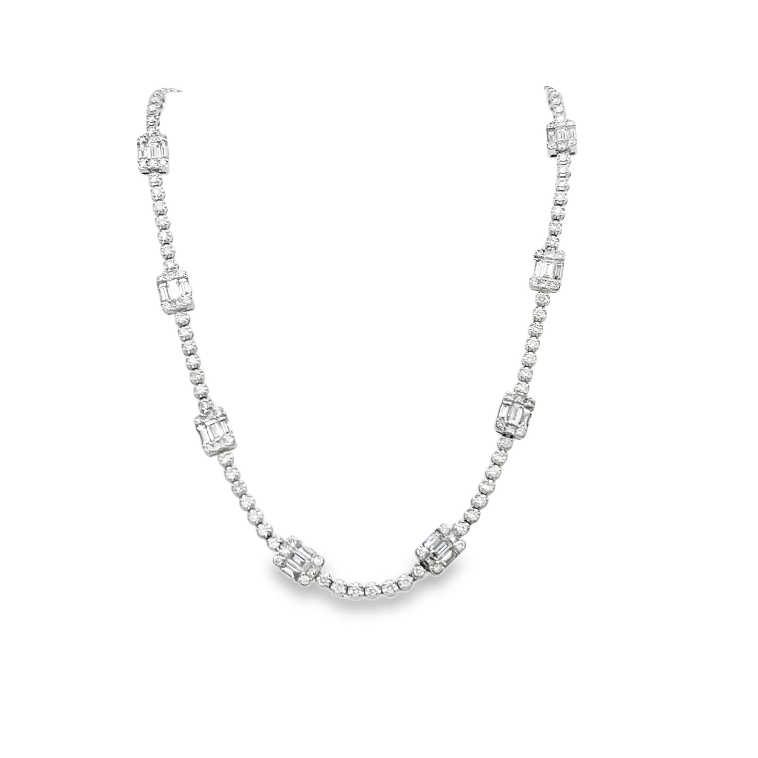 A modern take on a classic, this tennis necklace features sleek stationary sections of baguette diamonds, adding a sophisticated touch to the continuous brilliance of round diamonds. The perfect balance of elegance and structure, this piece is designed to shine effortlessly from day to night.-18k White gold-Round, Baguette Diamonds, 4.49cts-Necklace Length, 18"Item# 165-2000002 Diamond Station Necklace