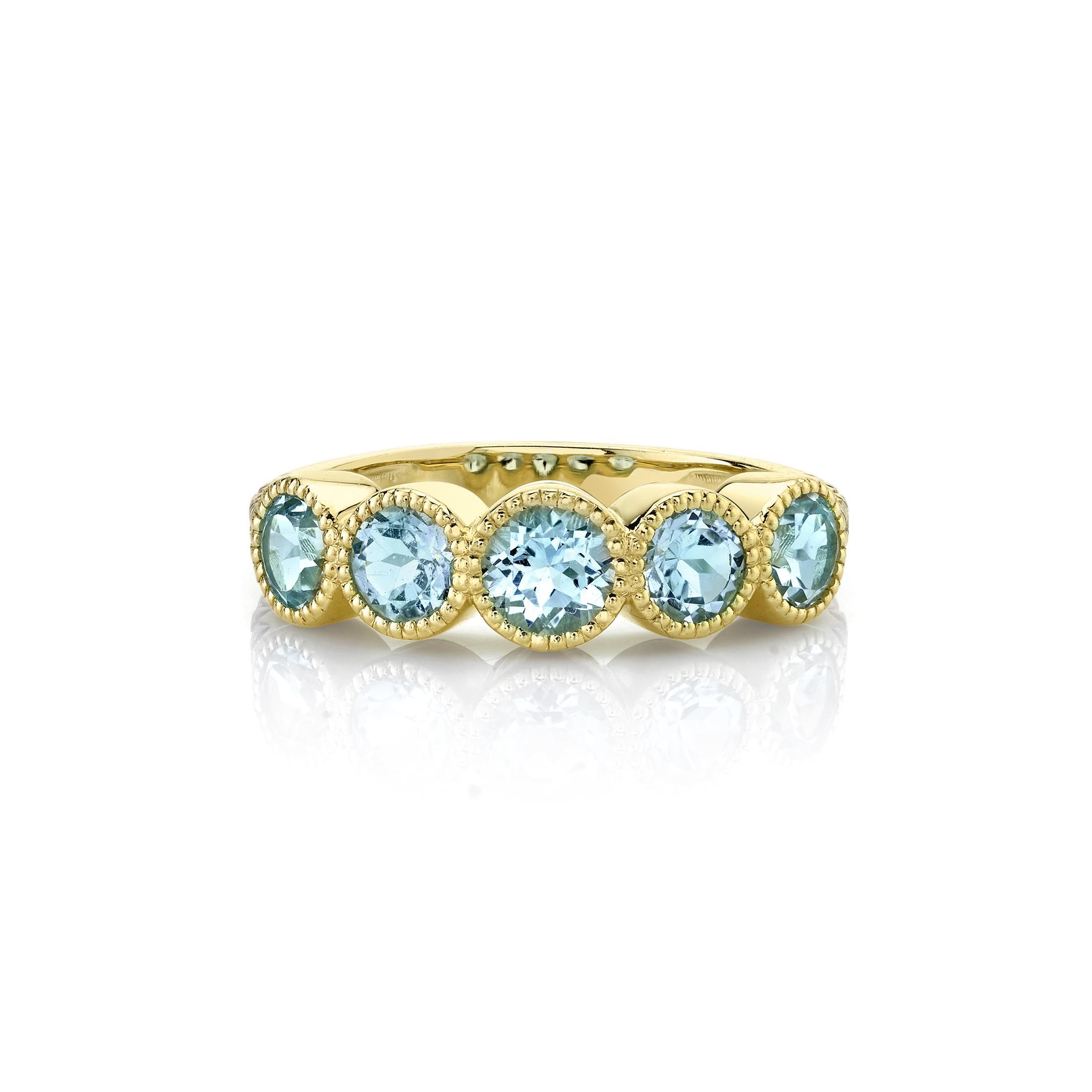 Expertly designed in Southern California, this piece combines bold lines with intricate details, creating a striking balance between modern flair and timeless elegance.-18k Yellow gold-Round sky blue topaz, 1.73cts-Round white diamonds, 0.14cts-Size 6.5Item# 804-2000124 Strie Wrapped Five-Stone Sky-Blue Topaz Band with White Diamonds