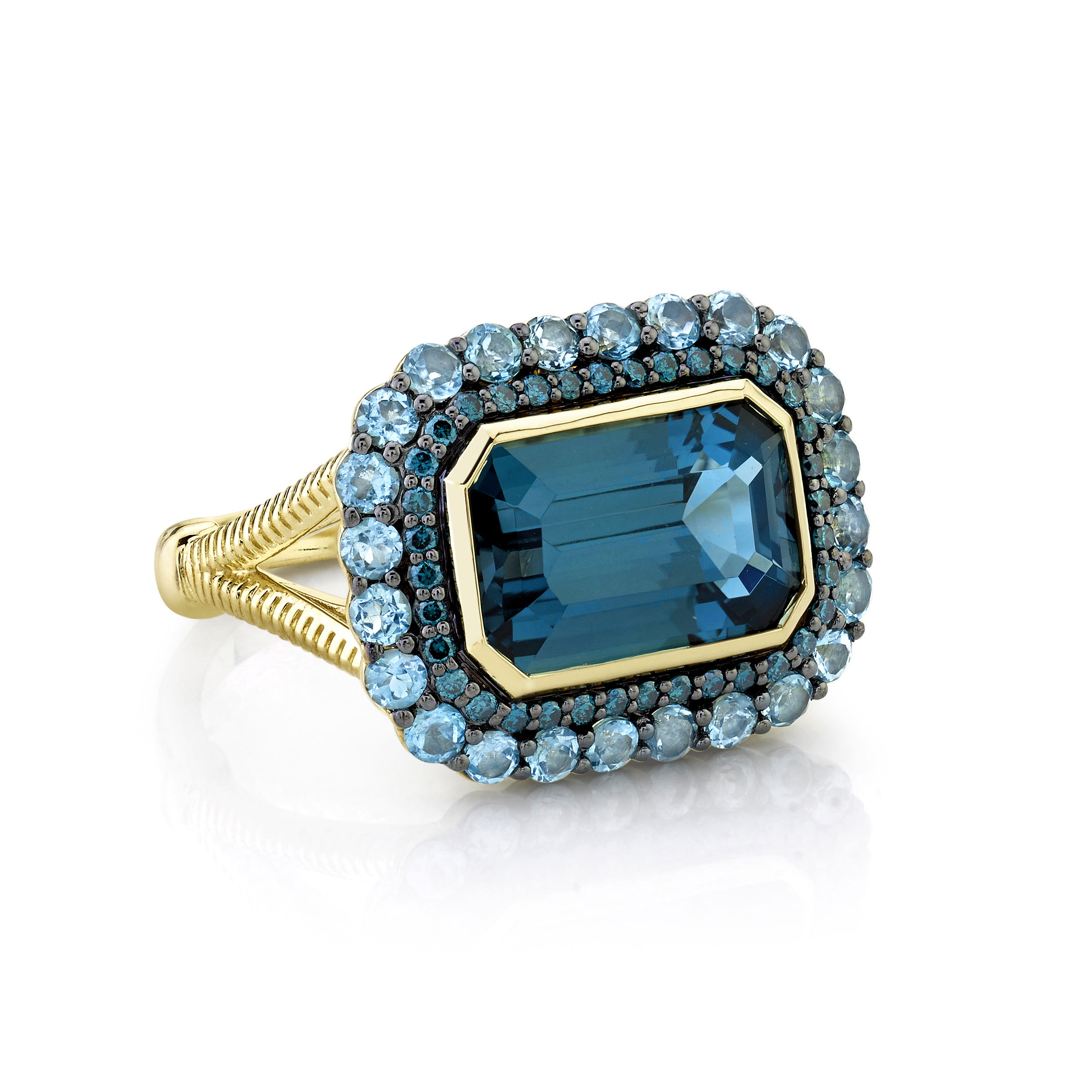 Expertly crafted in Southern California, this piece blends bold design with an elegant finish, making it a statement accessory for any jewelry lover.-18k Yellow gold-Emerald London blue topaz, 4.50ct-Round Swiss blue topaz, 0.98cts-Round blue diamonds, 0.21cts-Size 6.5Item# 804-2000136 London Blue Topaz Ring with Blue Diamond & Swiss Blue Topaz Halos, Strie Detail