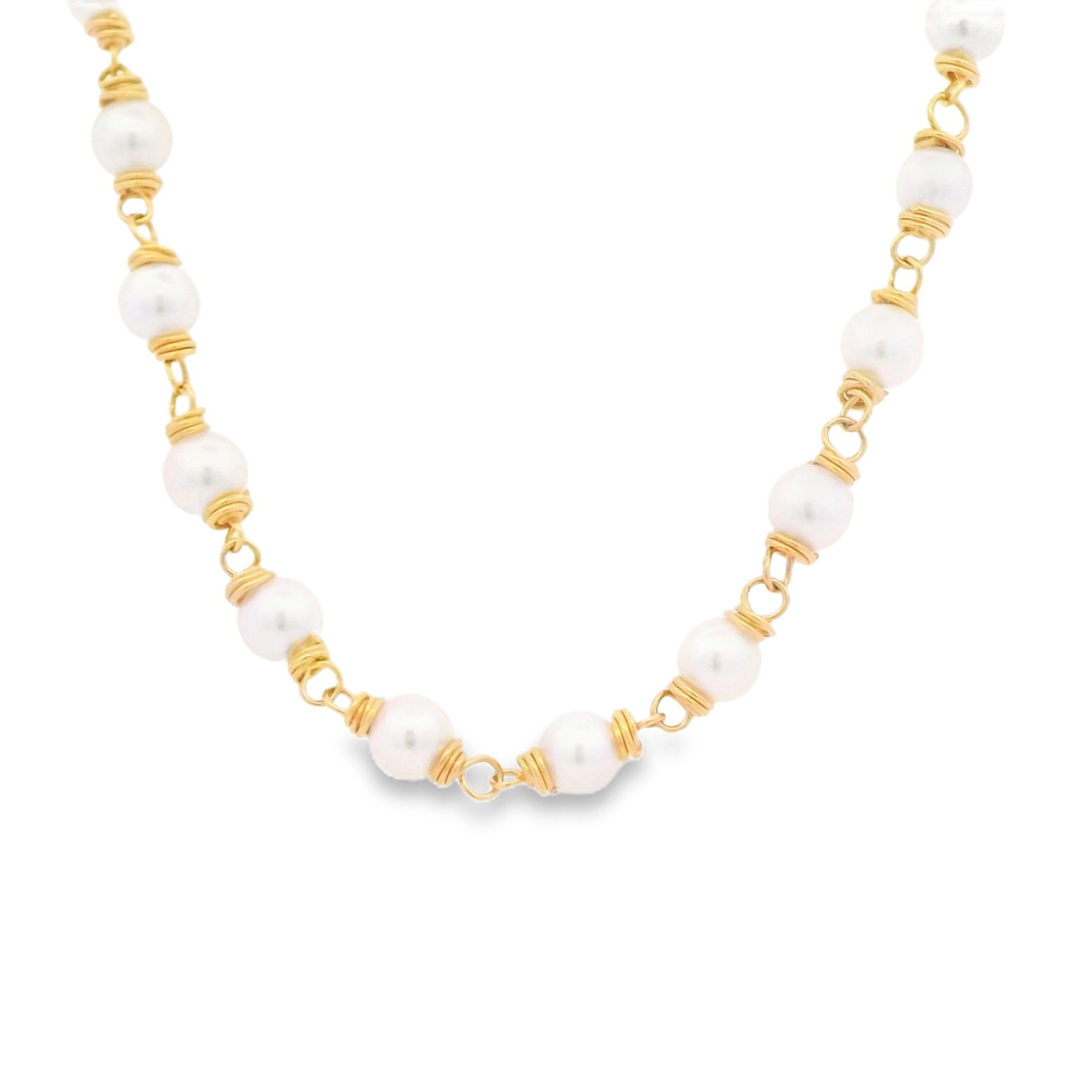 Erica Courtney presents this 18k yellow gold necklace features luminous freshwater pearls, creating a look that is both classic and graceful. Perfect for any occasion, it adds a touch of timeless elegance to any style.-18k Yellow gold-Fresh water pearls-Length 18"Item# 325-2000004 Wire Wrapped Pearl Necklace