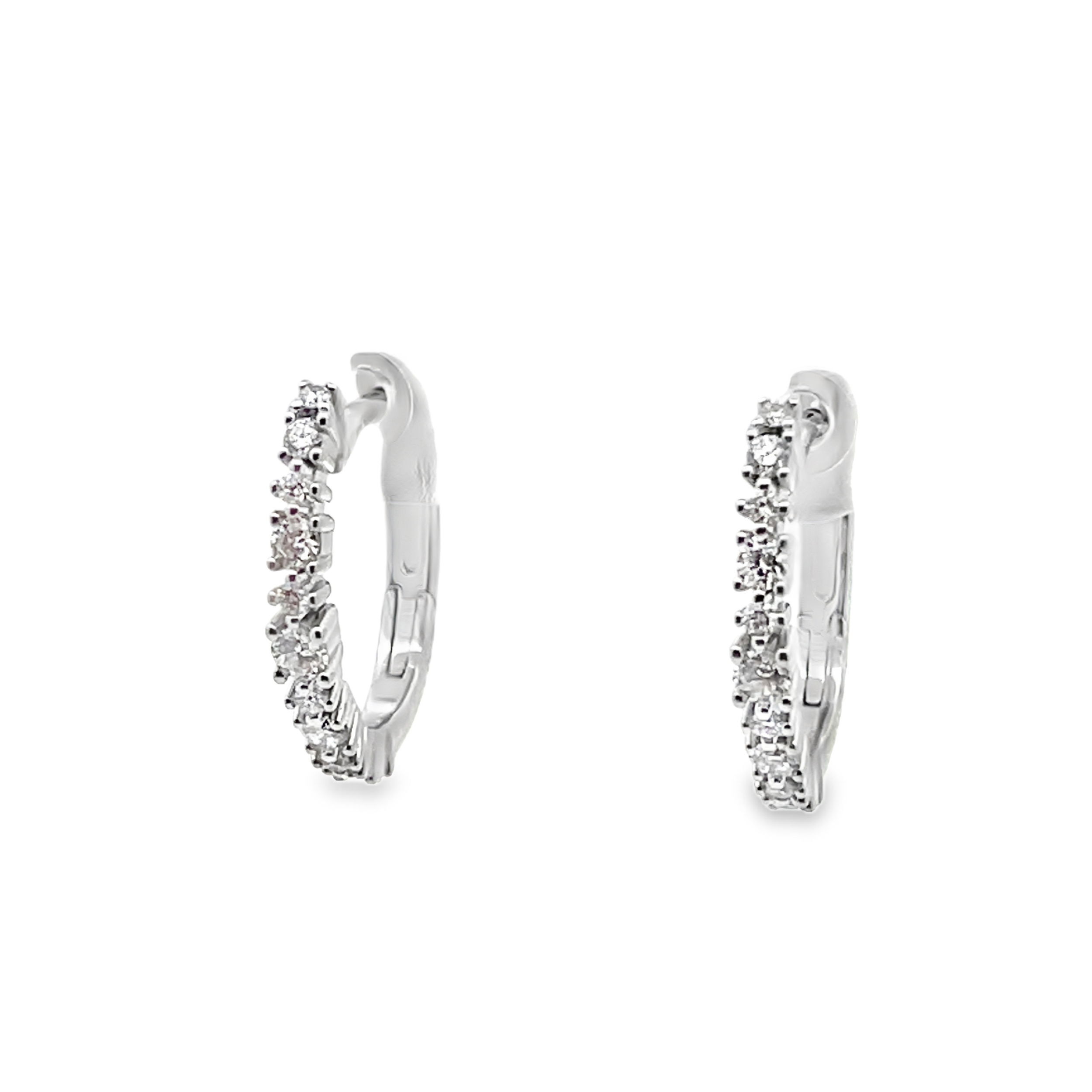 These white gold diamond hoop earrings radiate timeless elegance, featuring a seamless row of round-cut diamonds that sparkle brilliantly with each movement.-18k White gold-Round diamonds, 0.39ctsItem# 805-2000282 Diamond Hoop Earrings