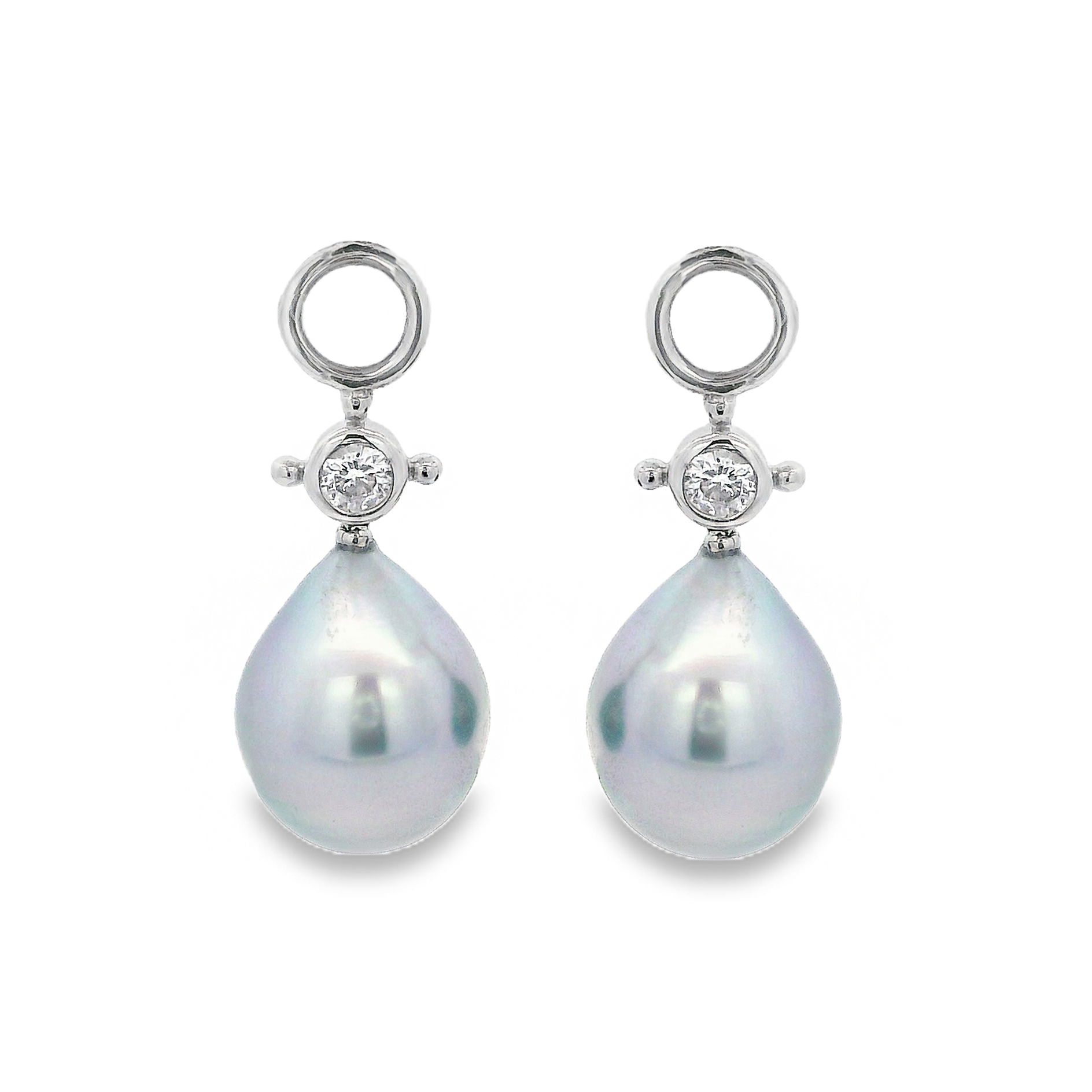 The elegant Joanne Earring Charms feature Tahitian pearls set in 18k white gold, accented by brilliant round diamonds. A perfect blend of sophistication and luxury, they add a touch of timeless beauty to any ensemble. Huggies sold separately.-18k White gold-Tahitian pearl-Round diamondsItem# ND-EAR-00005 Joanne Earring Charms