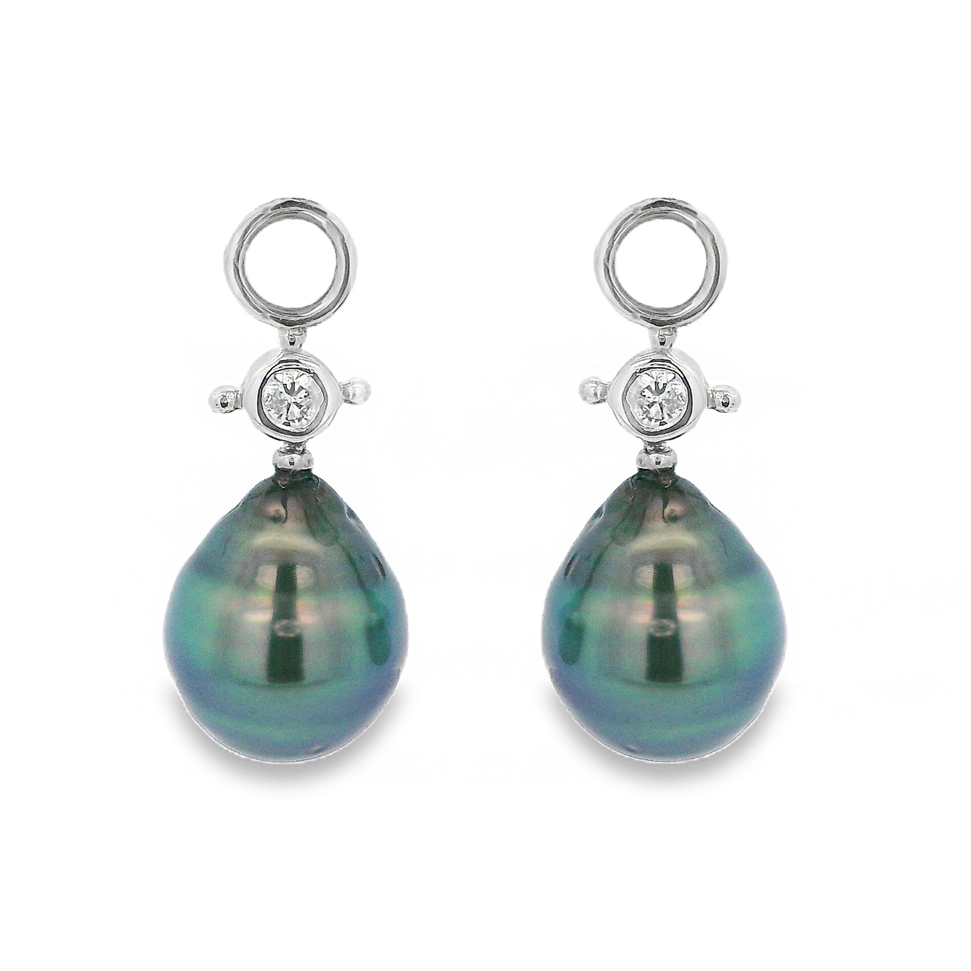 These 18k white gold earrings feature lustrous Tahitian pearls, accented by sparkling round diamonds for a refined yet striking look. Perfect for elevating any outfit, they bring a touch of luxury and timeless elegance. Huggies not included.-18k White gold-Tahitian pearls-Round diamonds, 0.18ctsItem# ND-EAR-00006 Judy Earrings