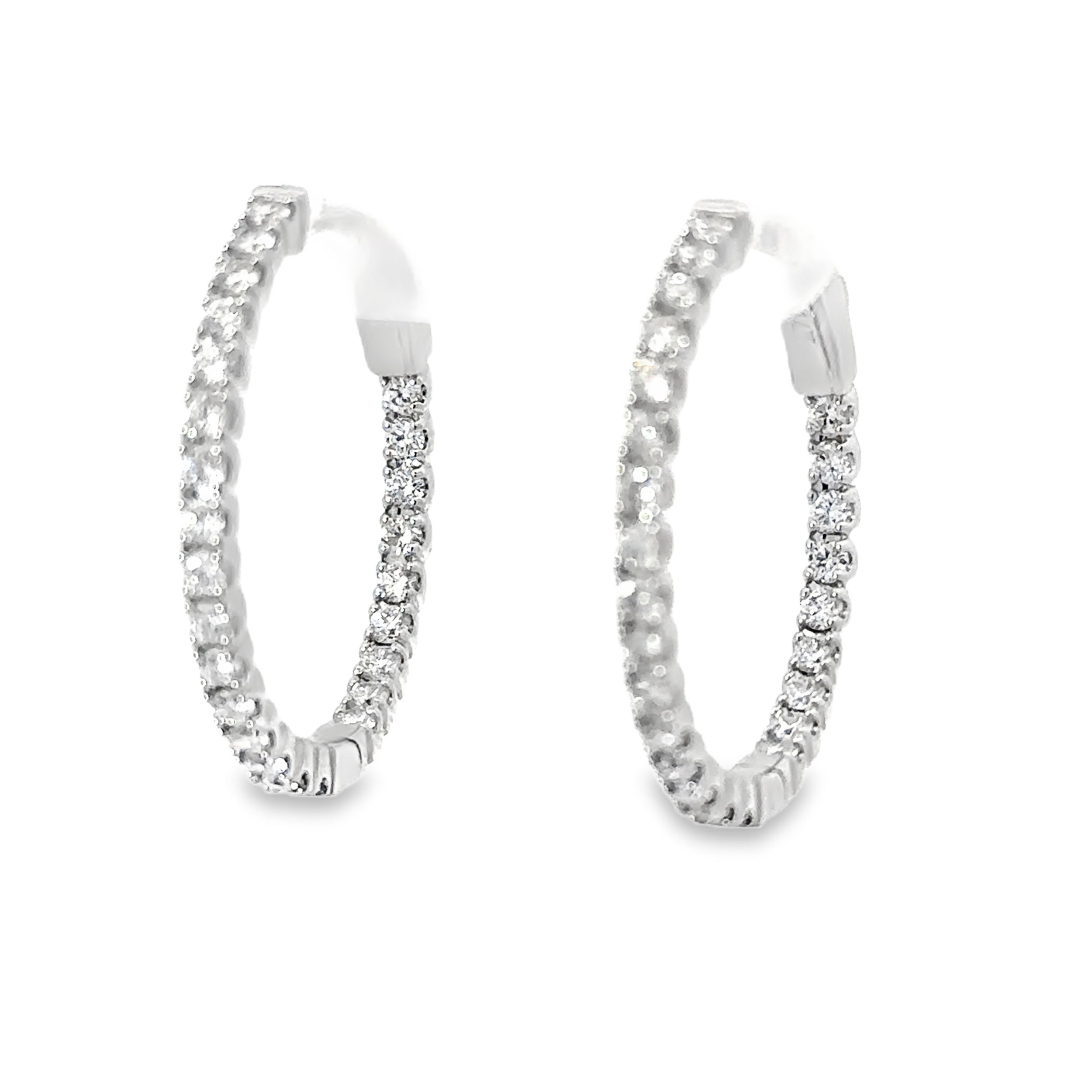 These hoops are adorned with sparkling diamonds on both the inner and outer edges, ensuring brilliance from every angle. Their timeless and elegant design makes them a dazzling addition to any jewelry collection.-14k White gold-Round white diamonds, 0.72ctsItem# 805-2000297 Inside Out Earrings