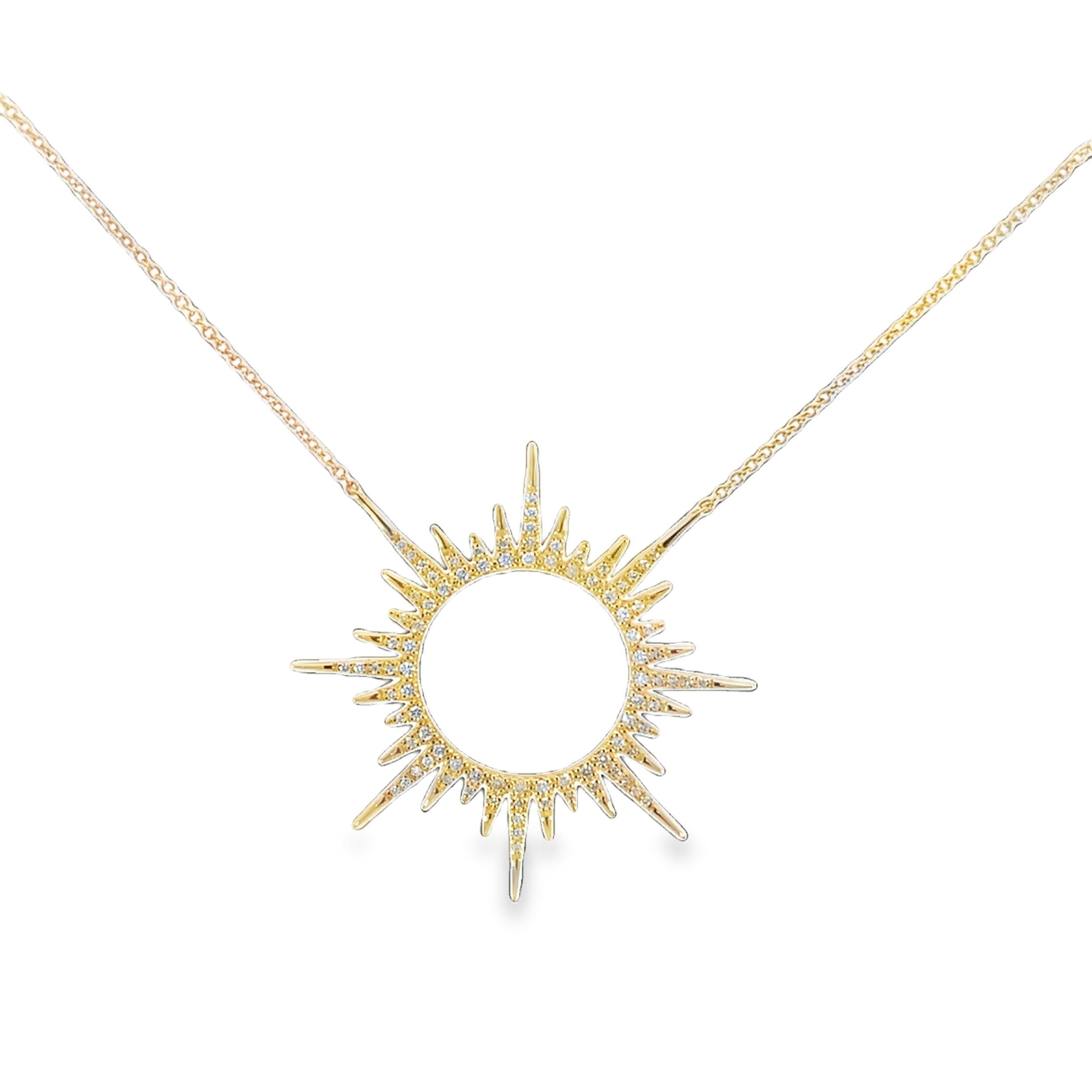 This necklace features radiant sunburst spikes extending from the center, each adorned with sparkling diamonds. The celestial-inspired design exudes brilliance and elegance, making it a stunning statement piece for any jewelry collection.-14k Yellow gold-Round white diamonds, 0.43cts-Length, 18.5"-14.5"Item# 807-2000213 Open Starburst Circle Charm Necklace