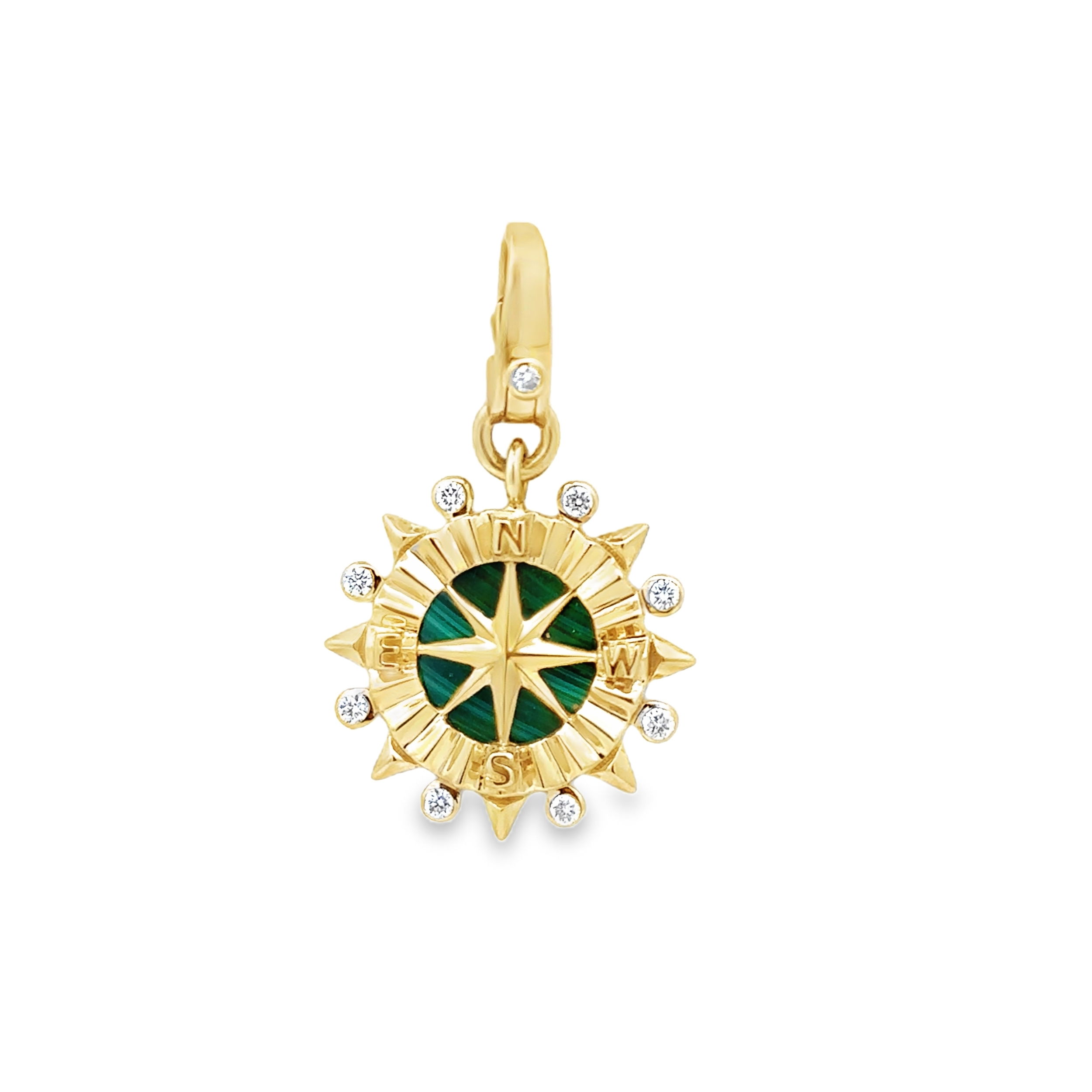 This charm features a vibrant malachite center, surrounded by sparkling diamonds arranged in a compass design. Featuring a lobster clasp attachment point with a diamond-accented lever, it adds both functionality and a touch of luxury. A stunning piece that combines rich color and elegance, it adds a sense of direction and sophistication to any jewelry collection.-14k Yellow gold-Malachite, 3.13cts-Round white diamonds, 0.16ctsItem# 806-2000082 Malachite & Diamond Compass Pendant