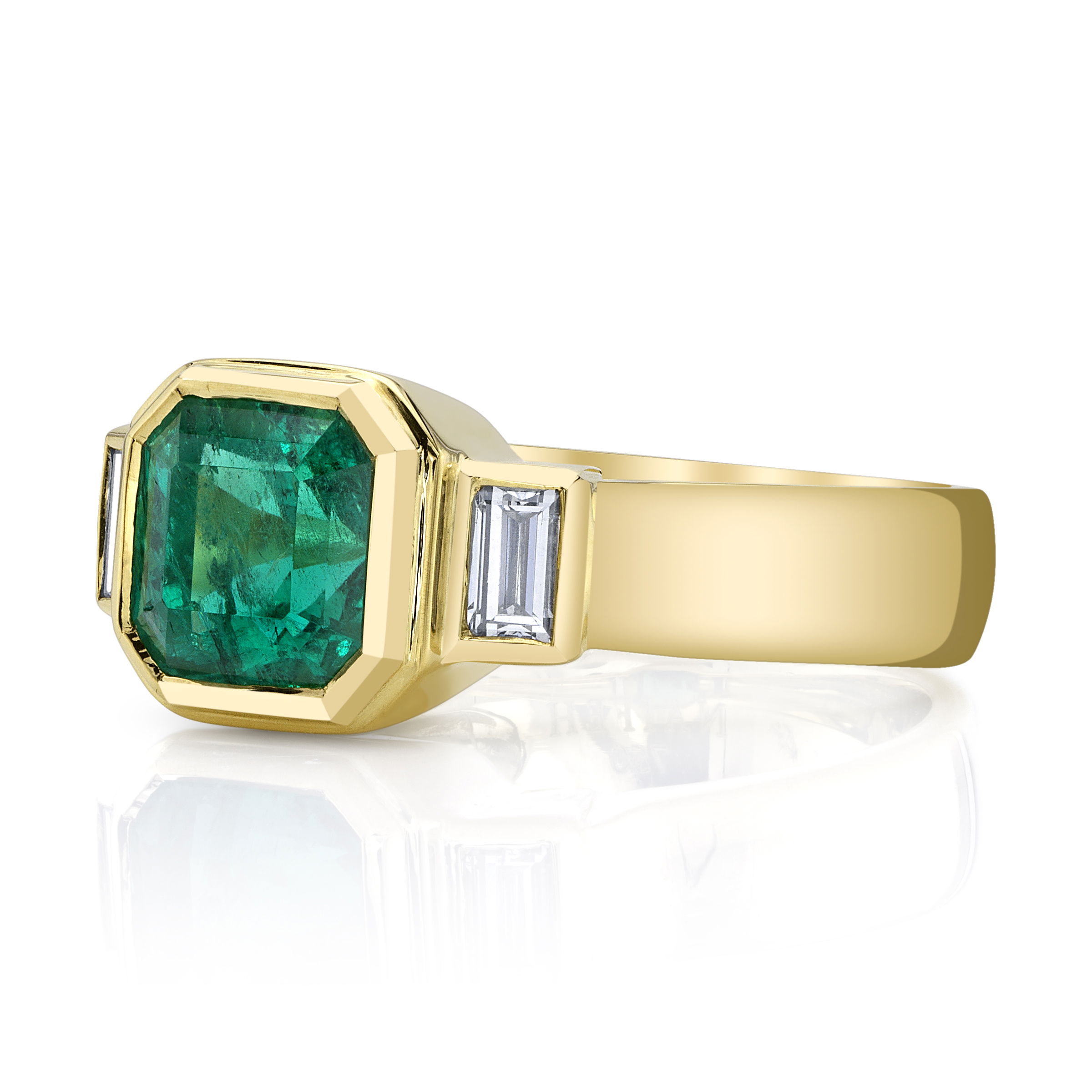 This 18k yellow gold ring showcases a captivating Colombian emerald flanked by two sleek baguette diamonds, adding just the right touch of sparkle. It’s a classic combination that’s effortlessly elegant and undeniably timeless.-18k Yellow gold-Colombian emerald, 2.52ct-Baguette diamonds, G-H/VS 0.36CTSItem# ND-Ring-00009 Decadence Ring