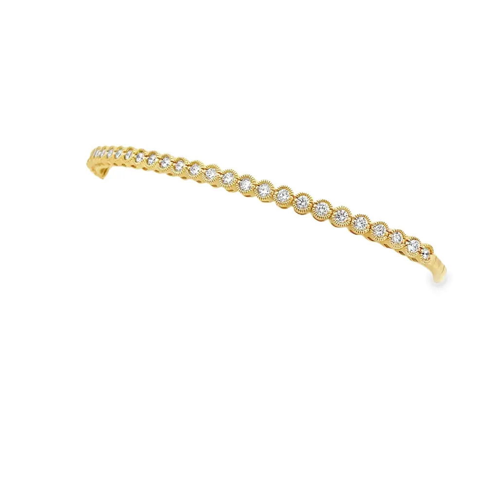 This bracelet features meticulously set diamonds within an intricate basket design, accented by delicate milgrain detailing. Its timeless elegance and vintage-inspired craftsmanship make it a sophisticated addition to any jewelry collection.-14k Yellow gold-Round white diamonds, 1.00ctsItem# 808-2000166 Milgrain Basket Diamond Flex Bracelet