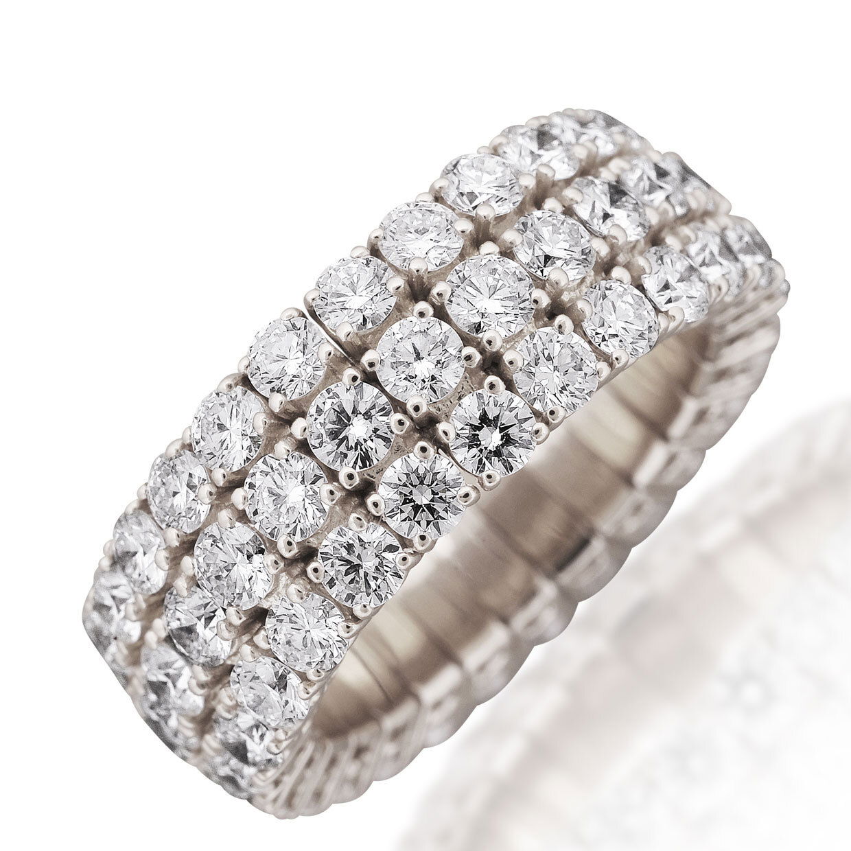 The Xpandable Collection is a revolutionary new line of rings and bracelets that features an innovative technology that solves the problems of tailoring and comfort.-18k White gold-Round diamonds, 4.55cts-Expandable Size, Contact for sizing optionsItem# 130-2000022 Xpandable Three Row Band