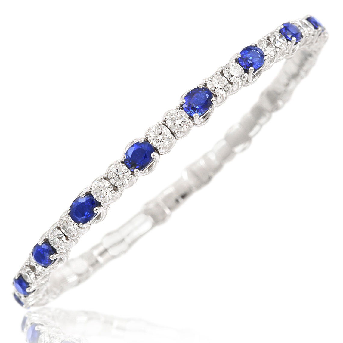 The Xpandable Collection is a revolutionary new line of rings and bracelets that features an innovative technology that solves the problems of tailoring and comfort.-18k White gold-Oval Blue Sapphires, 6.41cts-Round diamonds, 4.09cts-Expandable Size, Contact for sizing optionsItem #: 170-2000022 Xpandable Sapphire & Diamond Bangle
